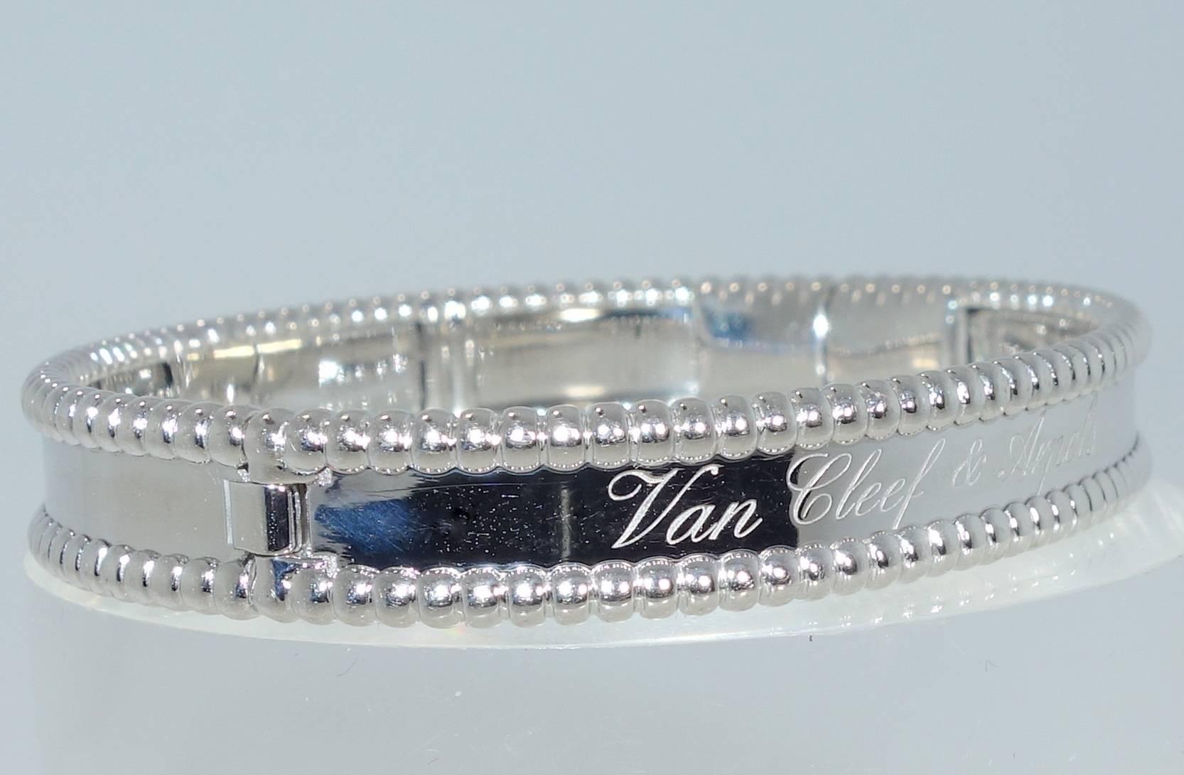 18K white gold, this simple and elegant statement for the wrist comes from the famous house of Van Cleef & Arpels.  This classic statement is from the Perlee signature creations are are engraved with the arabesques of a calligraphied Van Cleef