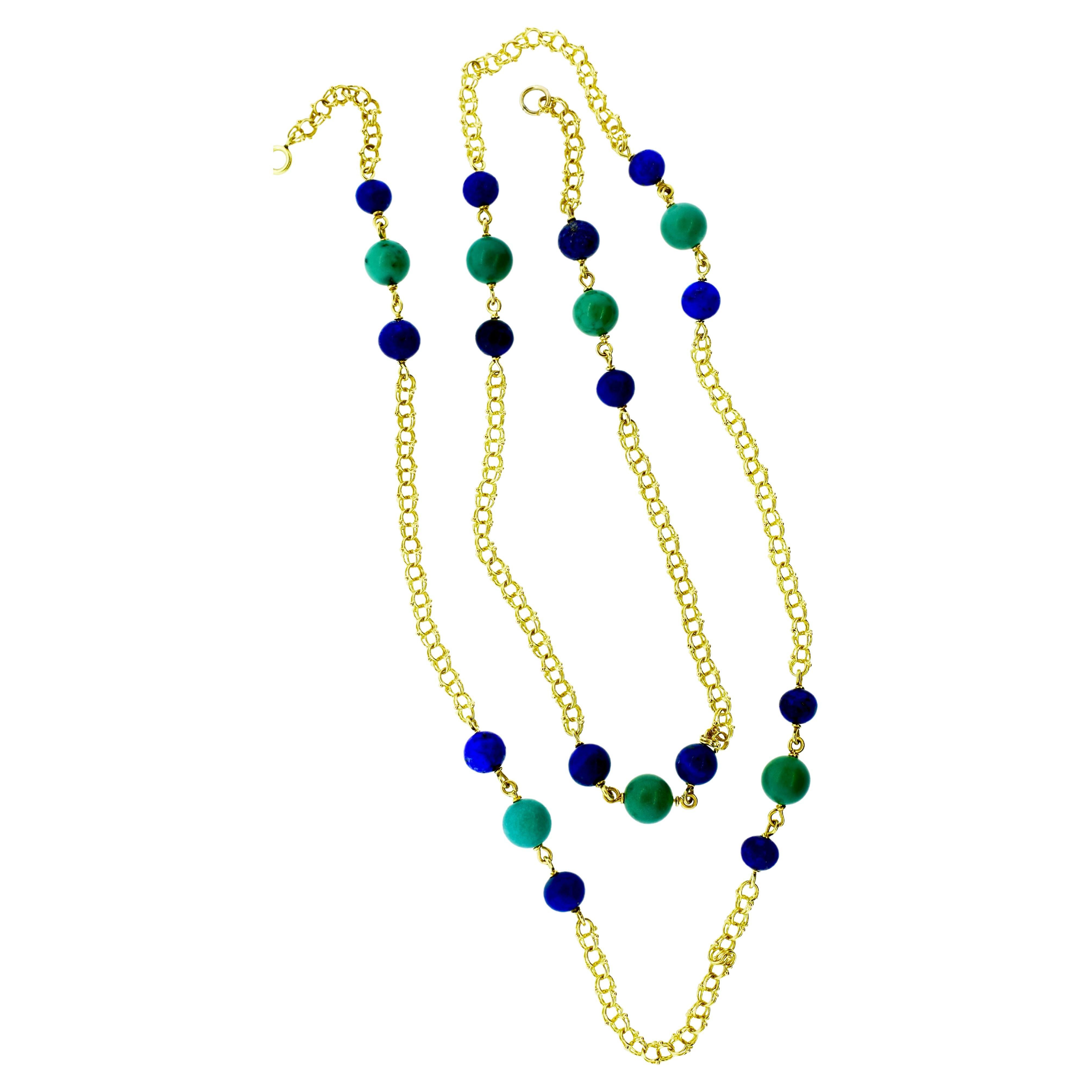 Long gold chain circa 1950 accented with bright blue lapis lazuli spheres and  green-blue turquoise.  The lapis beads range in size from 7.3 to 8.3.  The turquoise beads range in size from 9.3 to 9.5.  The intricate gold chain is 4.5 mm wide.  The