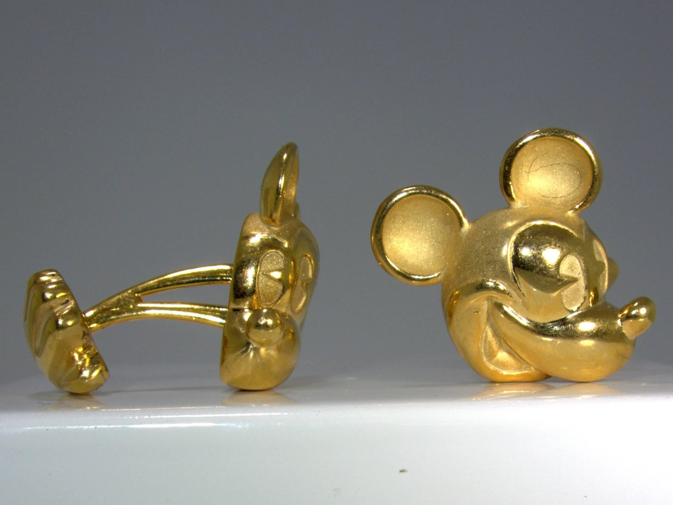 Signed Jose Hess and Disney (he probably made these for Disney),14K Micky Mouse cufflinks, with one side his head and the other his hand.  These charming links are well made and an unusual find on the market today by a master goldsmith.
