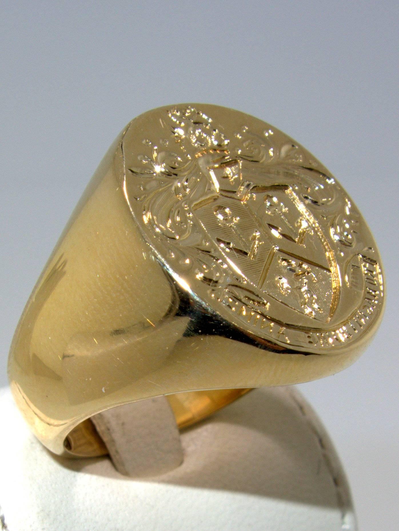 Hand made in 14K with well crafted signet ring has in Latin inscribed: " Do things with friendship in mind".  This ring is now a 12 1/4.  We can size it up or down if need be.