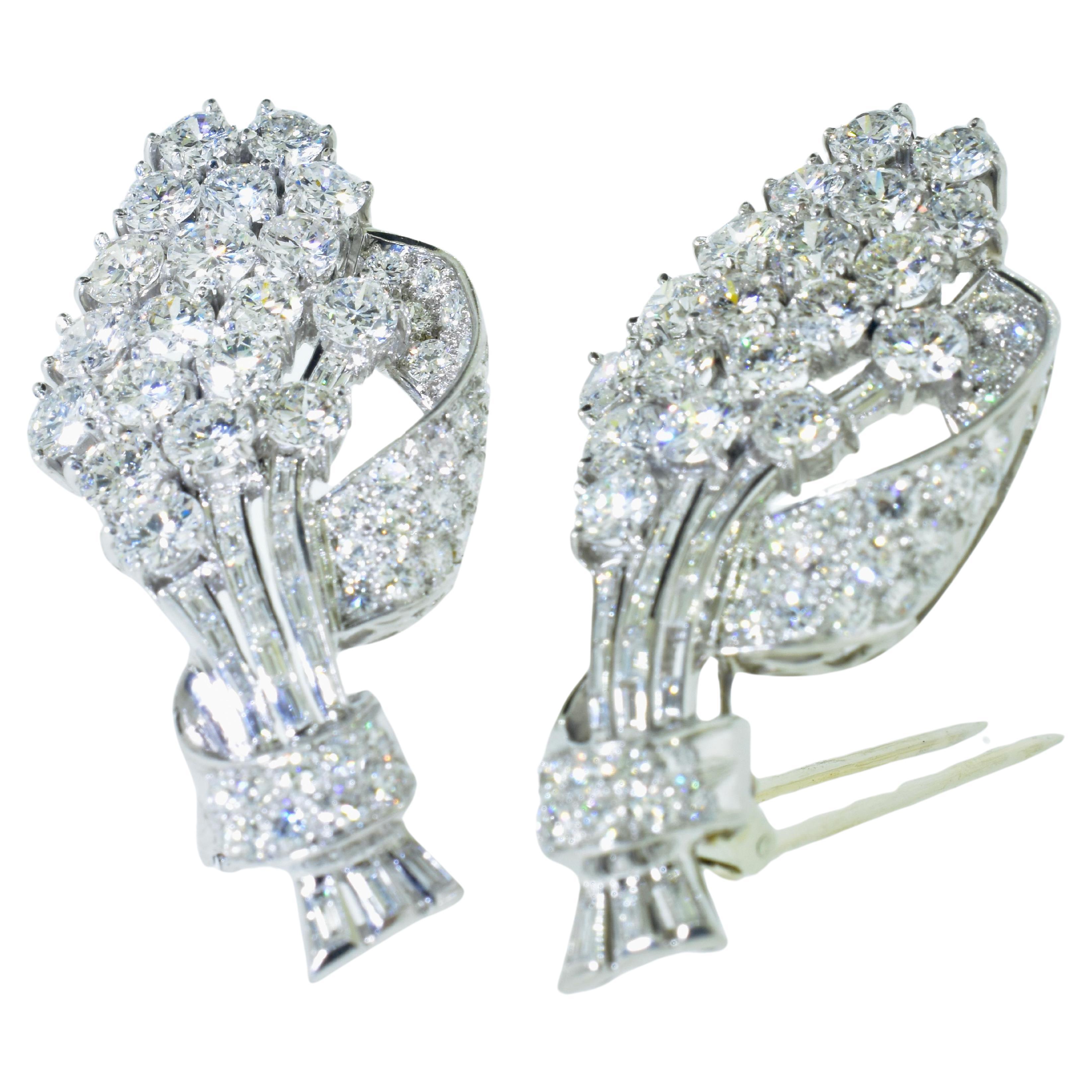 Art Deco Diamond Brooch and Dress Clips in platinum. Well made with fine white diamonds, this brooch can be separated into two stylish dress clips. There are an estimated 10 cts of near colorless, G/H in both European cut diamonds and baguette cut
