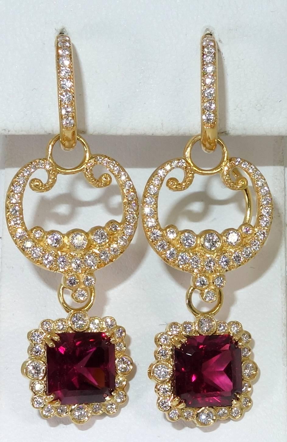 Versatile because they can be worn five different ways.  These earrings are well made, bright and unusual.  The Rhodolite garnets are clean and bright and well matched.  The color is superb.  They weigh totaling approximately 6 cts.  There are 2.15