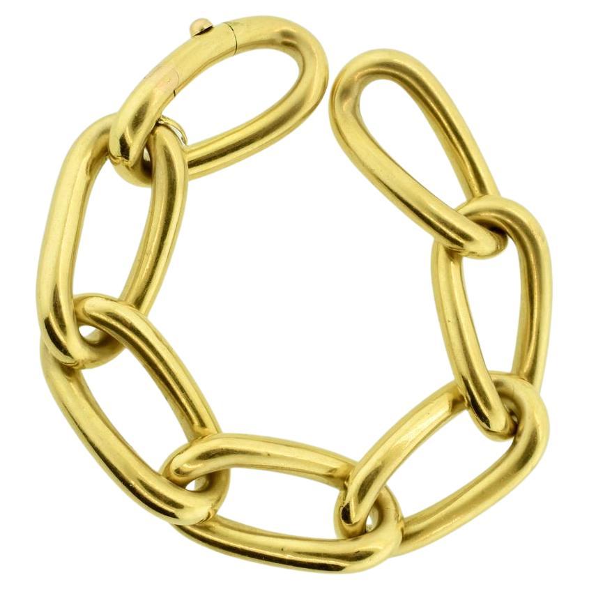 Cartier Paris 18K yellow gold large link bracelet, circa 1950.  8 1/2 inches in length and weighing 76.4 grams, this seven link large bracelet is signed in engraved script Cartier Paris and numbered.

Most women, after a proper introduction to its