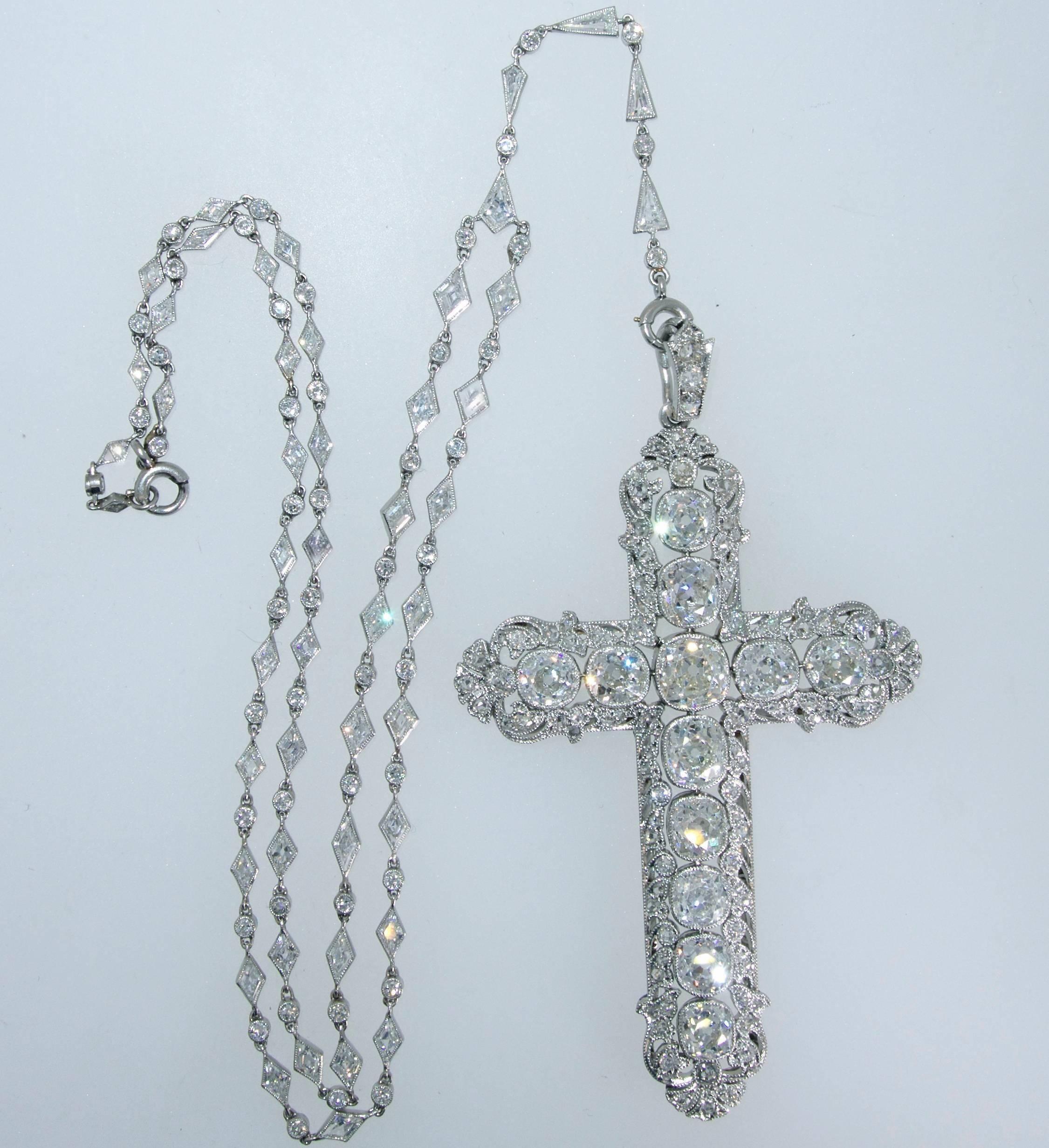 With over 12 carats of European cut diamonds, this is a magnificent antique cross which is suspended on an antique fancy cut diamond chain.  The cross is 3 inches in length and has superb workmanship.  Circa 1900