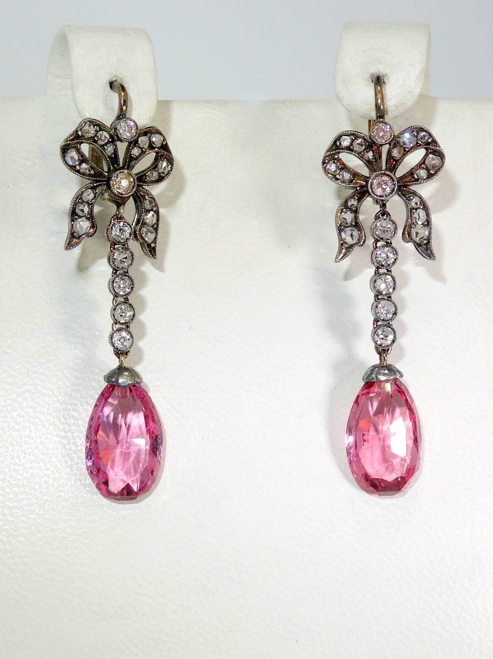 Certificate from the A.G.L. (American Gem Lab), accompanies these earrings and states that the matching pink spinels are natural with no evidence of heat treatments.  The bright pink stones which weigh 10.17 cts., are suspended from 46 rose cut and