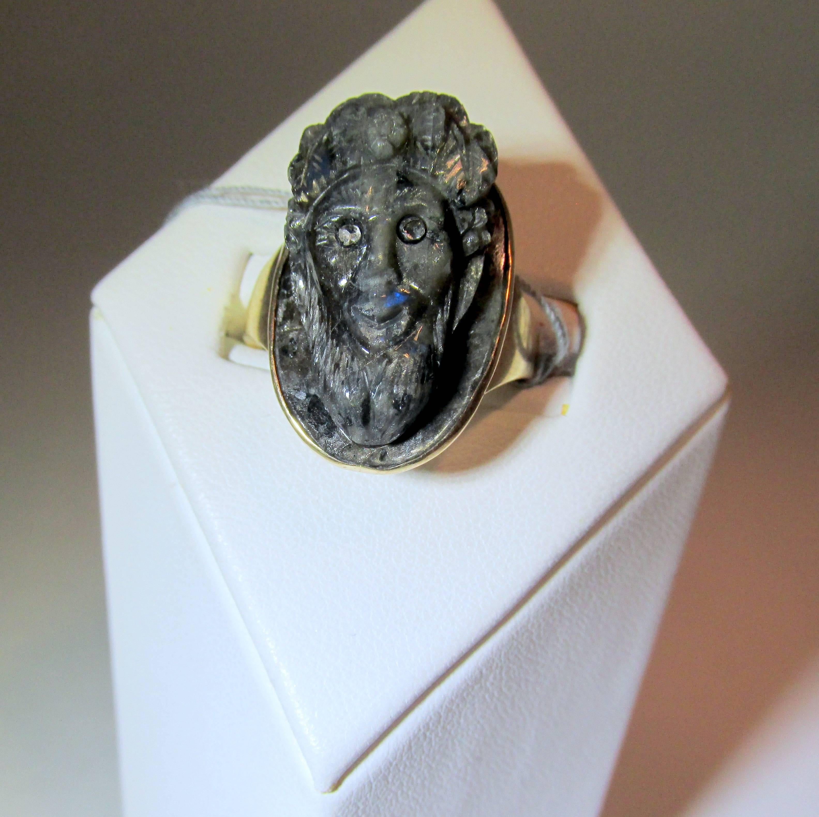 With rose cut diamond eyes, this is a well executed, 3 dimensional carving held in a yellow gold bezel.  This antique ring is in fine condition, we can size this ring to any size.
