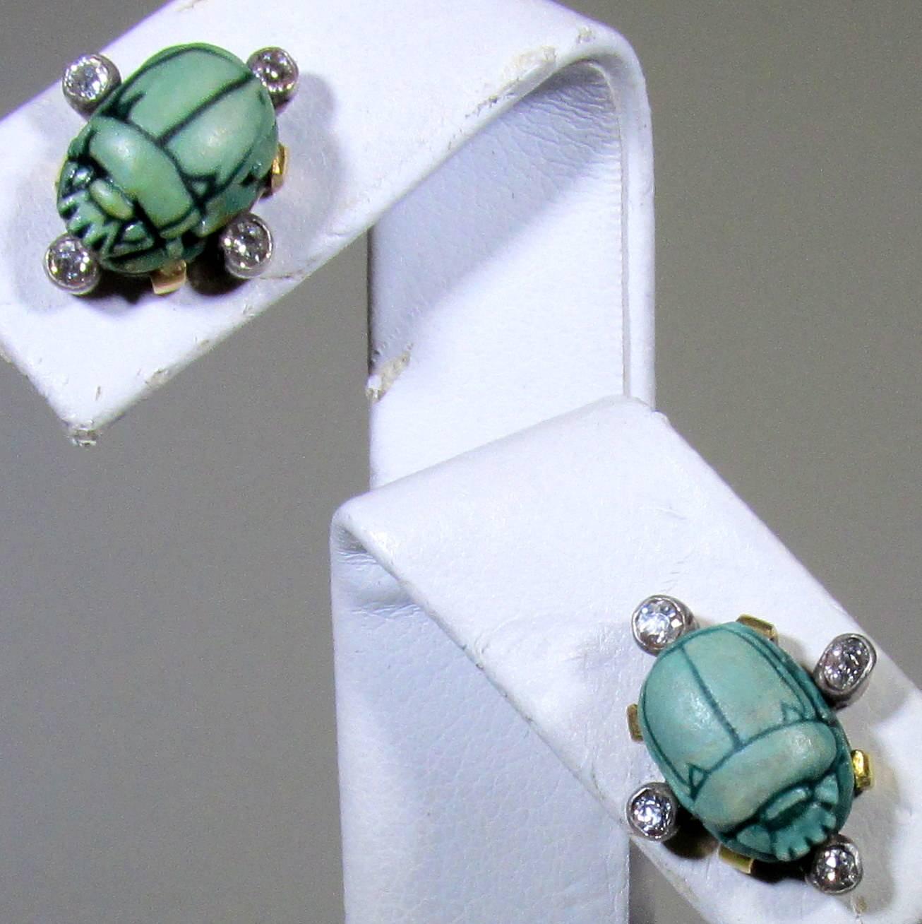 There are 4 round European cut set at the quadrants accenting the blue/green scarabs which are carved faience (an ancient ceramic) and  the center motif of these small but choice Victorian ear studs.