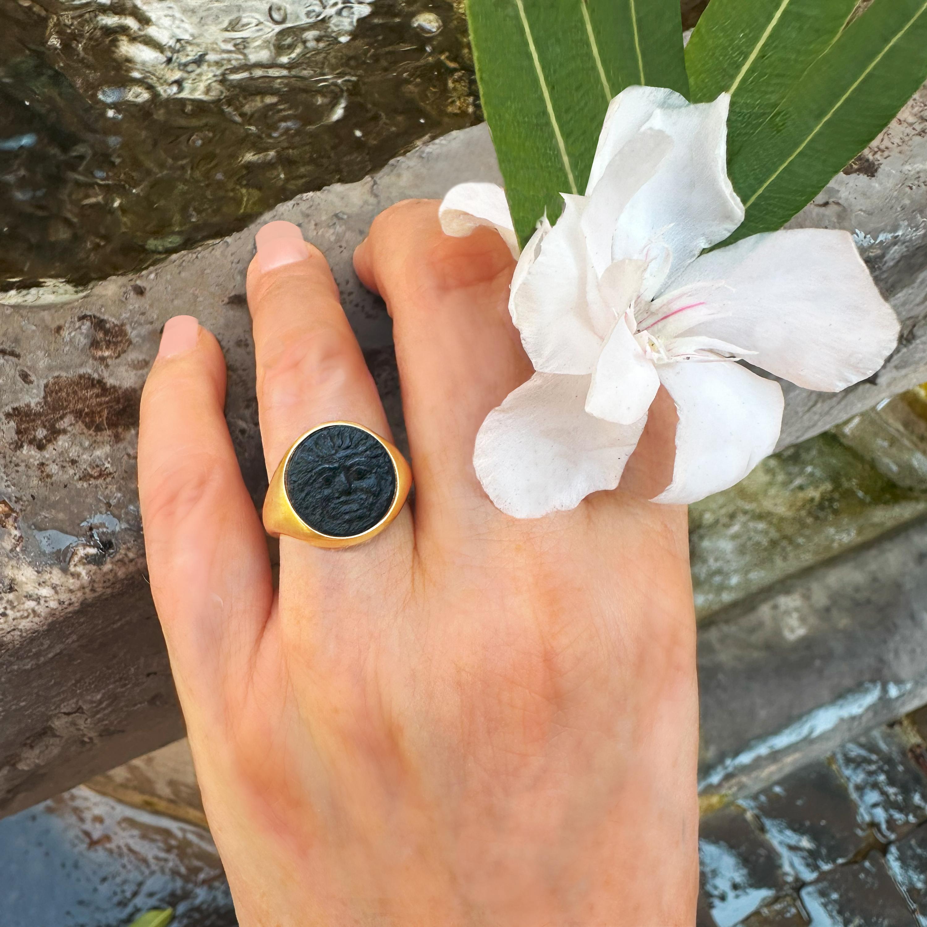 This exquisite 18 kt gold ring features an authentic bronze Greek coin from 420-405 BC, adorned with a striking depiction of the Gorgon, a mythical figure steeped in ancient lore.

The Gorgons, consisting of three sisters—Medusa being the most