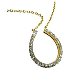 Collier vintage en or jaune 14 carats avec un diamant en forme de fer à cheval
