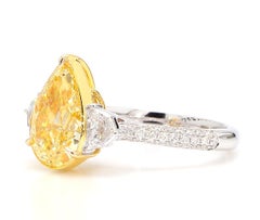 GIA Certified 3.01 Carat Fancy Yellow Pear Diamond Gold Platinum Ring