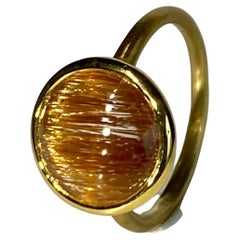 18kt Brushed Yellow Gold Ring set with a Rutile Quartz Cabochon