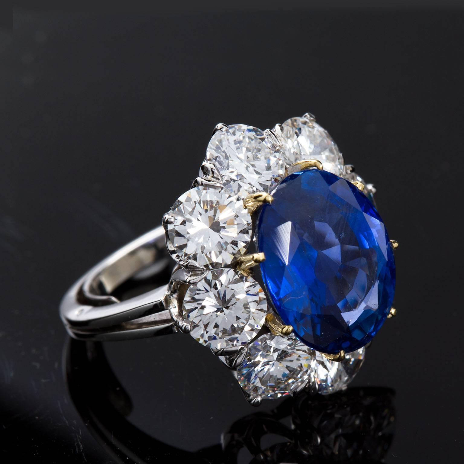 A 7.28 oval cut blue sapphire unheated in a diamond cluster ring of white gold.  Diamond weight approx. 6 ctw.

No. 7759