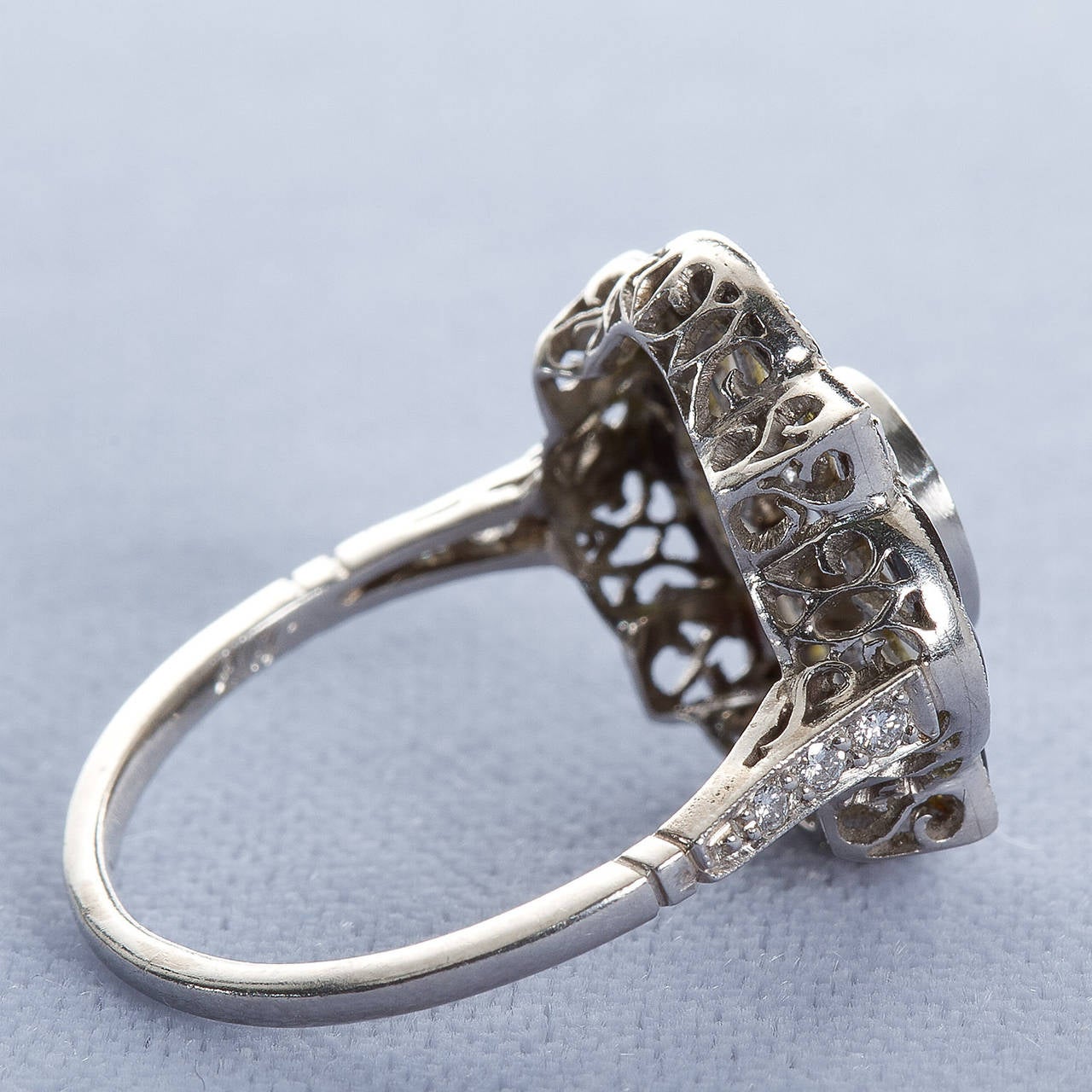 A wonderful antique platinum ring with old European center diamond of approx 1.10 carat surrounded by carved black and white onyx.

Dealer ref No. 4912