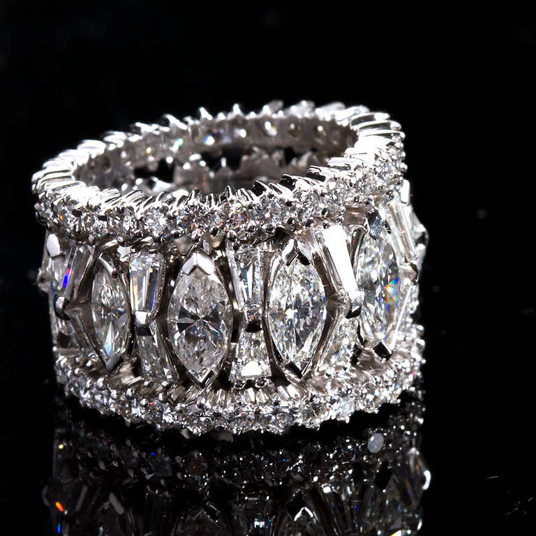 A mixed-cut diamond eternity band containing marquise, tapered baguette, and round brilliant shapes of VS+ and H+ color diamonds with a total carat weight of approximately 10.15cts.
Ring size 6.25 US.

Dealer ref No. 5556
_
TMW Jewels Co. is a