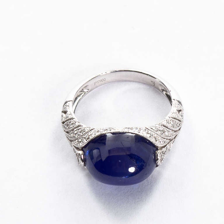 Antique platinum ring with horizontally set cabochon sapphire 9.22cts with GIA report stating it to be Burmese No-Heat with diamond accents. 

Dealer ref. 5836