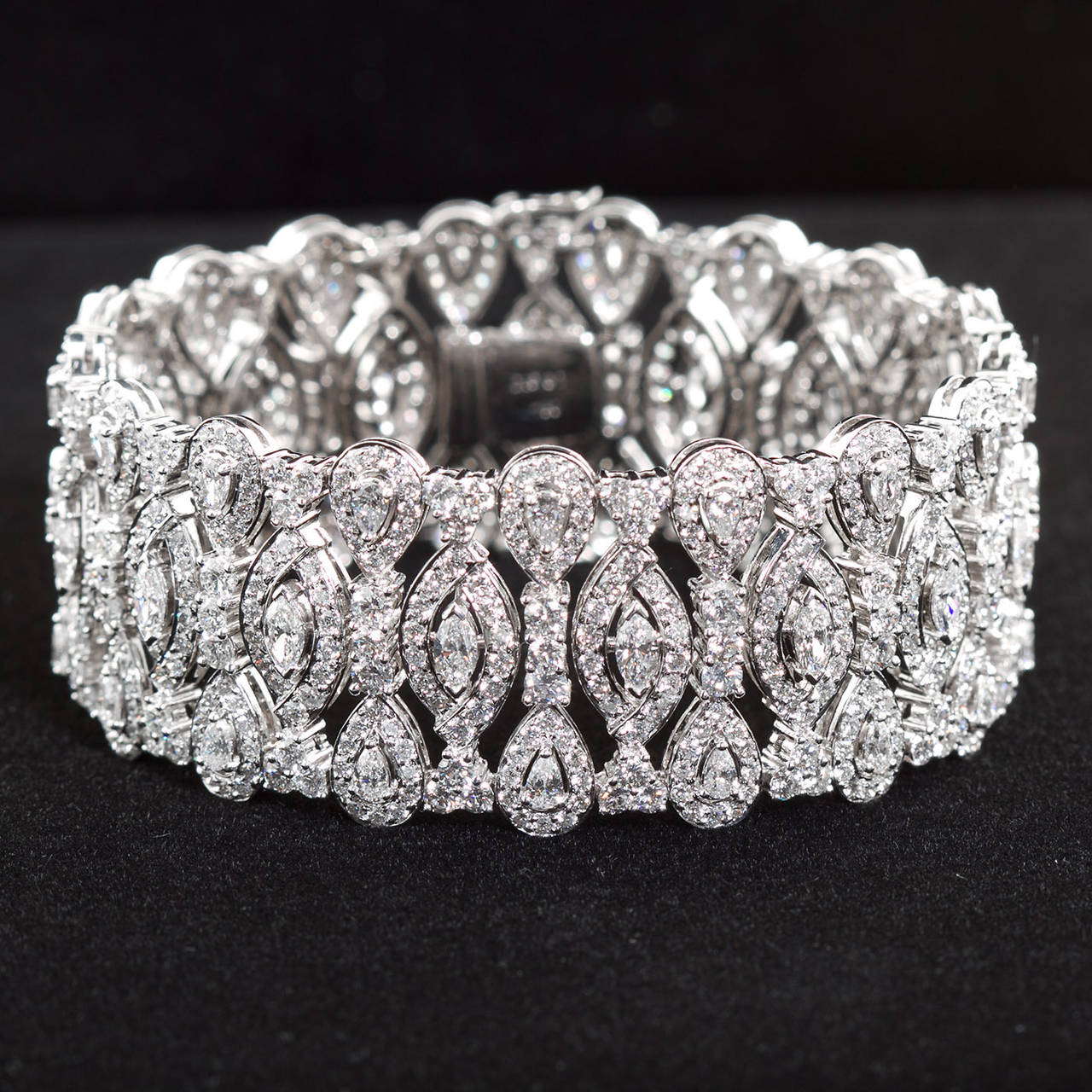 A very fine diamond in 18k white gold wide bracelet with marquise and pear shape and round brilliant diamonds of approximately 20 carats total weight.

Dealer ref No. 6388