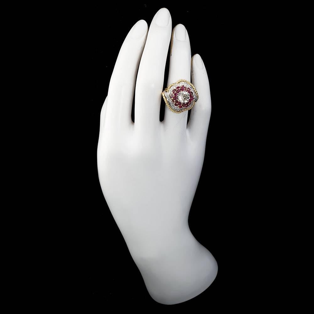 A vintage 1960's 18 karat rope gold diamond ring set with a 2.00 carat (approximate weight) old European cut center diamond skirted by round cut rubies and diamonds.

Diamond is I-J color, SI clarity. Diamond is approximately 7.75 mm in