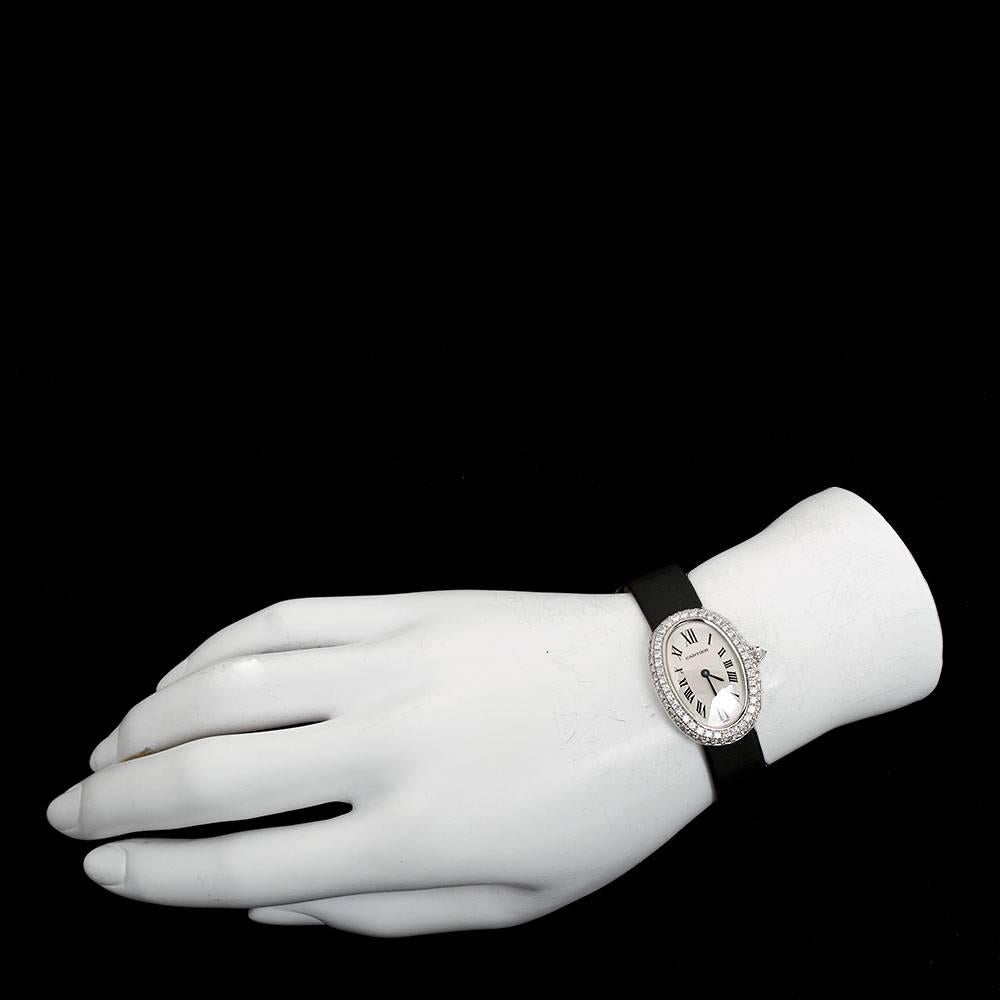 The familiar ellipse shape, the Baignoire watch is the essence of Cartier style.

Baignoire watch, small model, quartz movement. 
18K white gold case set with 80 brilliant-cut diamonds. Blued-steel sword-shaped hands. Sapphire crystal.

Dark