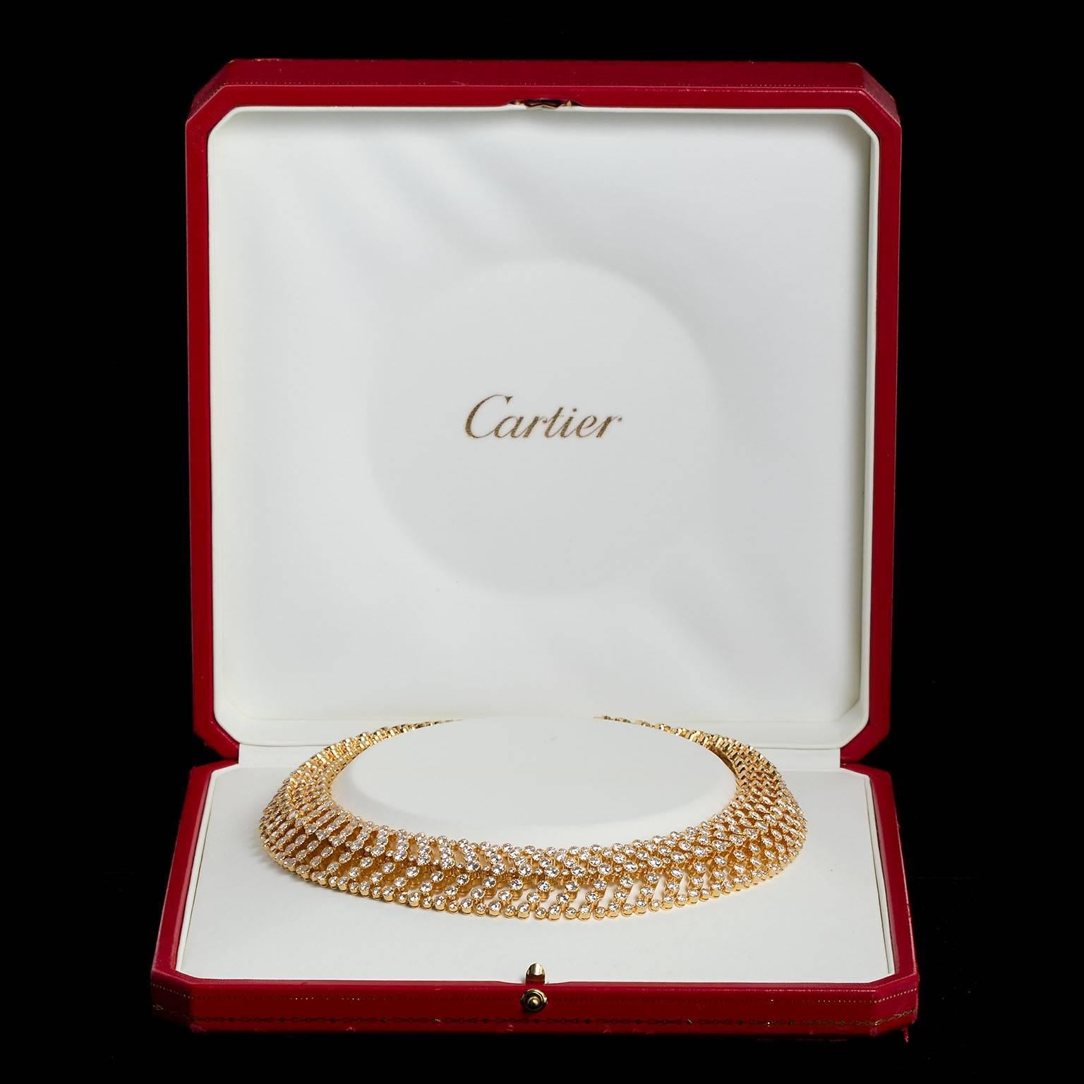 A vintage veined feather style diamond in 18 karat gold necklace by Cartier. Set with approx. 55 carats of round brilliant cut diamonds ranging from 0.03 to 0.25 cts.  Signed and numbered by Cartier Paris.  Fantastic crimped barrel style bezel