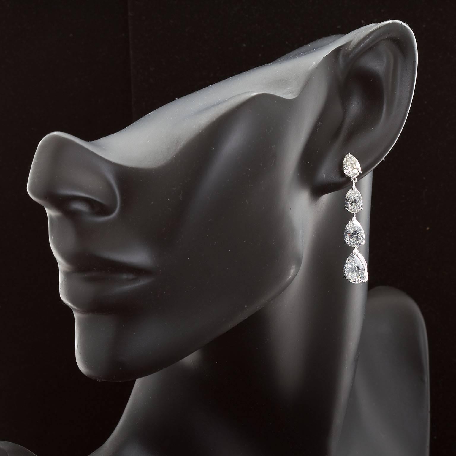 A pair of very fine diamond in platinum long dangle earrings. Set with eight pear shape diamonds ranging in size from 0.99 ct to 2.43 ct. G-I color Vs-SI clarity. 11.83 carats total weight. Some have GIA certificates. These earrings are extremely