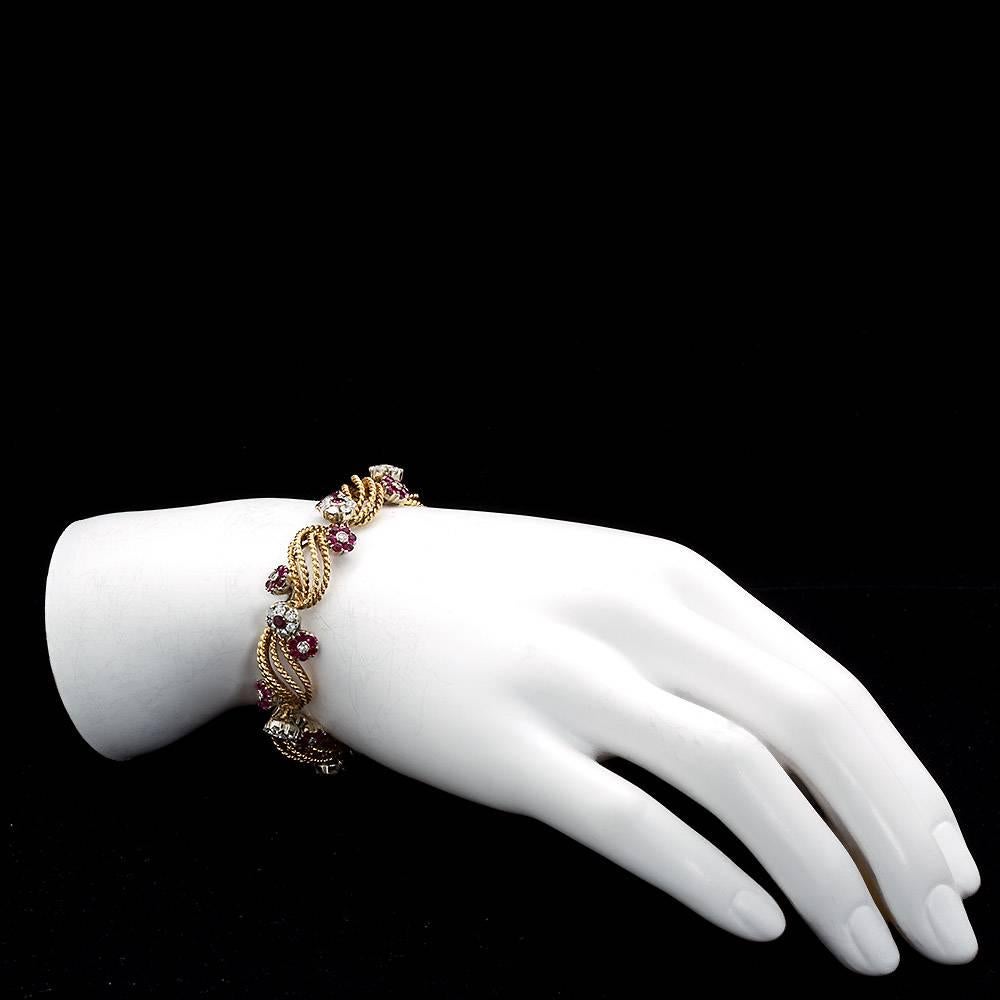 This bracelet is delicate on the eyes and on the hand. Very well crafted 18k gold links and settings contains ~3.00 carats of high color and clarity diamonds with ~2.90 of rubies.
7