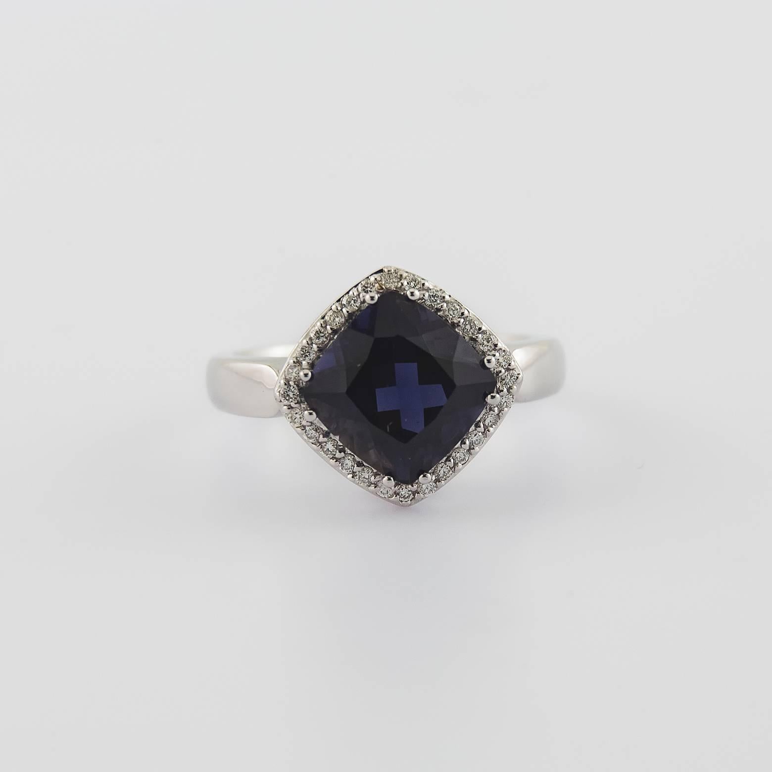 Approximately 4 carats of deep, dark and stunning Iolite bordered with fabulous bright sparkly diamonds. If this Iolite were any darker it would black like the nights sky. It's a statement piece, timeless and its absolutely gorgeous! Just about a