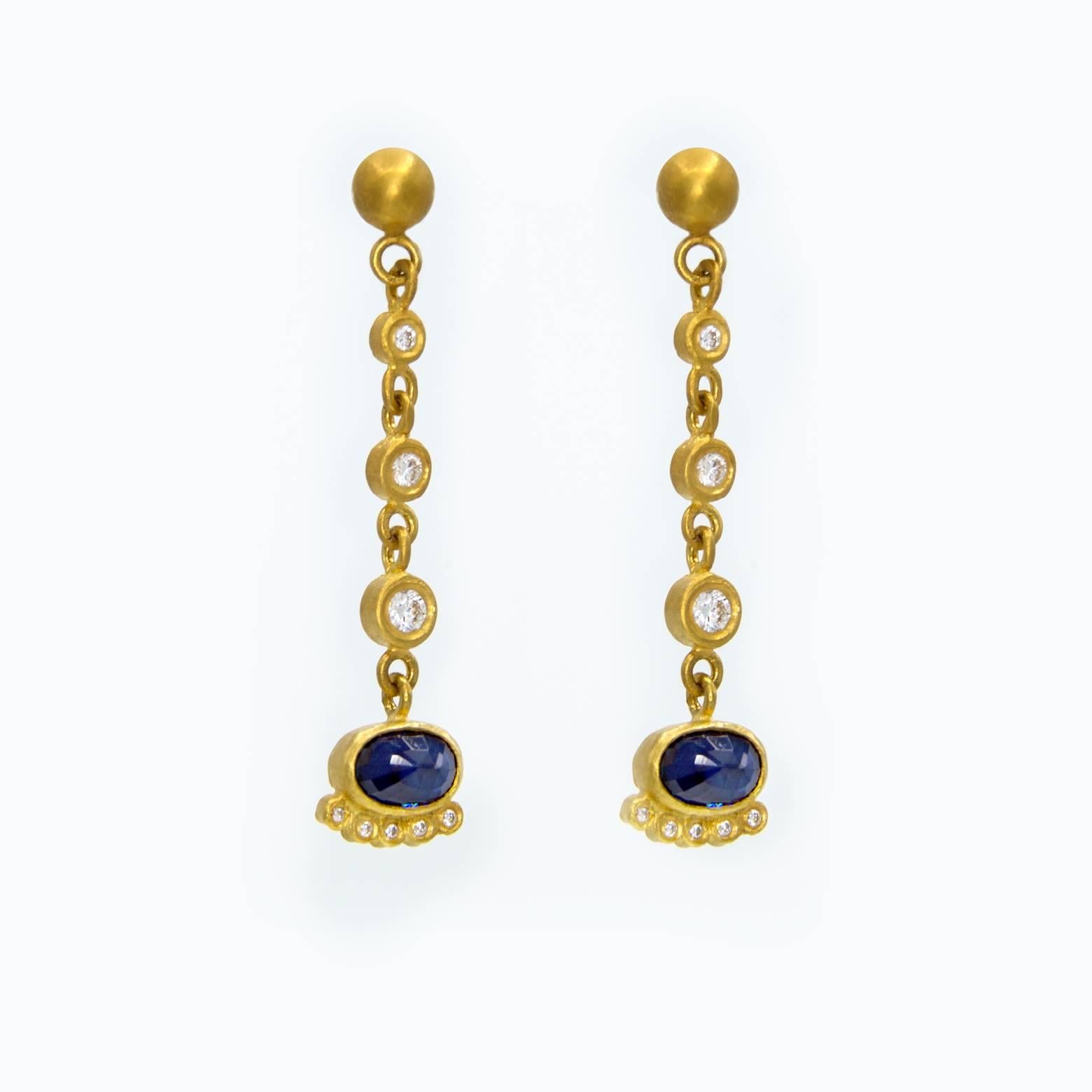 Sapphires, diamonds and gold. Elegant and refined, yet fun. These earrings have such a unique design to them that you'll want to wear them as often as you can. Elegant and artistic, playful and professional. The total weight of the diamonds in both