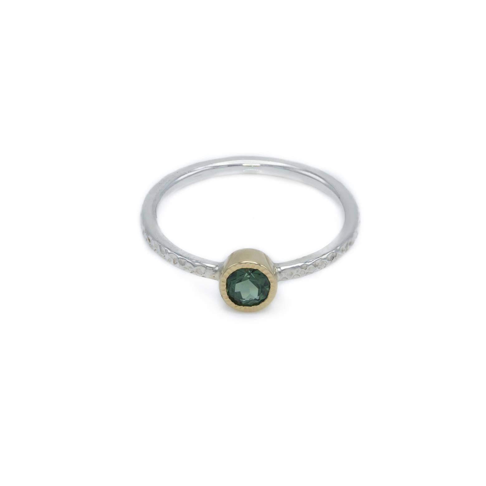 Beautiful sea green tourmaline set in a textured gold bezel with a bright white hammered sterling silver band. Artistic and interesting! A great stacking ring yet substantial enough to wear alone. Size 6.25