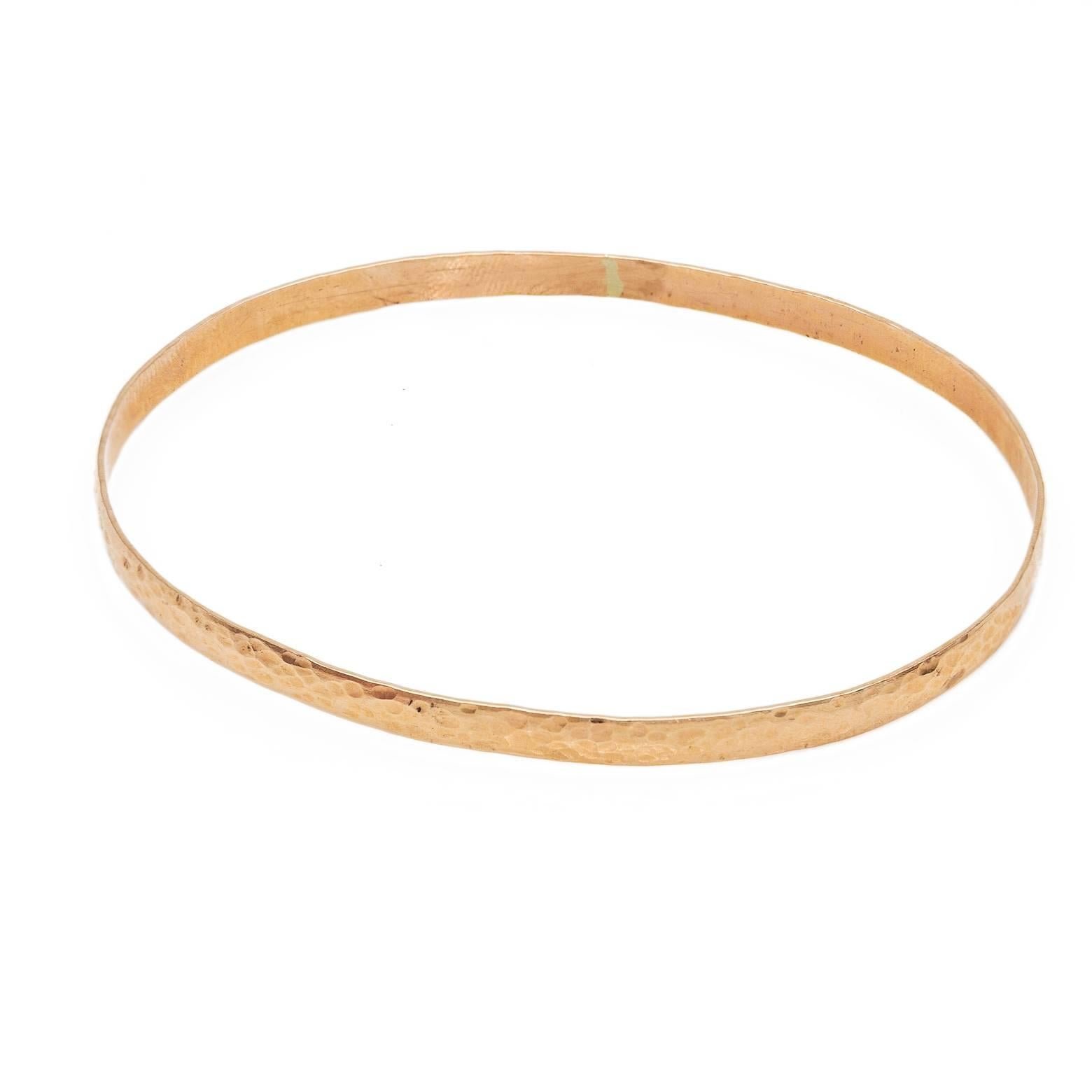 This oval bangle with the hammered texture is a wonderful bracelet to wear alone or stack with your collection. The hammered texture adds sparkle and depth.