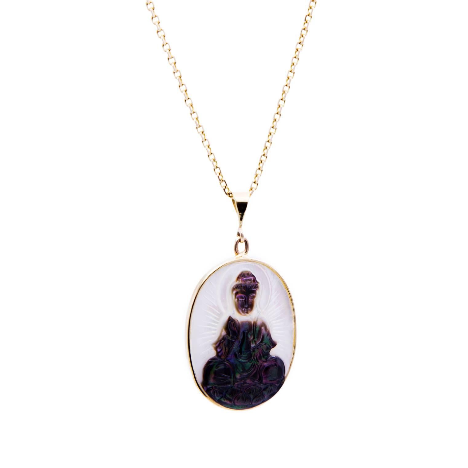 A beautiful hand carved mother of pearl pendant from a black lipped oyster in the Cook Islands-this pendant glows! Quan Yin, the female manifestation of the Buddha is exuberantly carved in fine detail. A wonderful halo around her crown and lines of