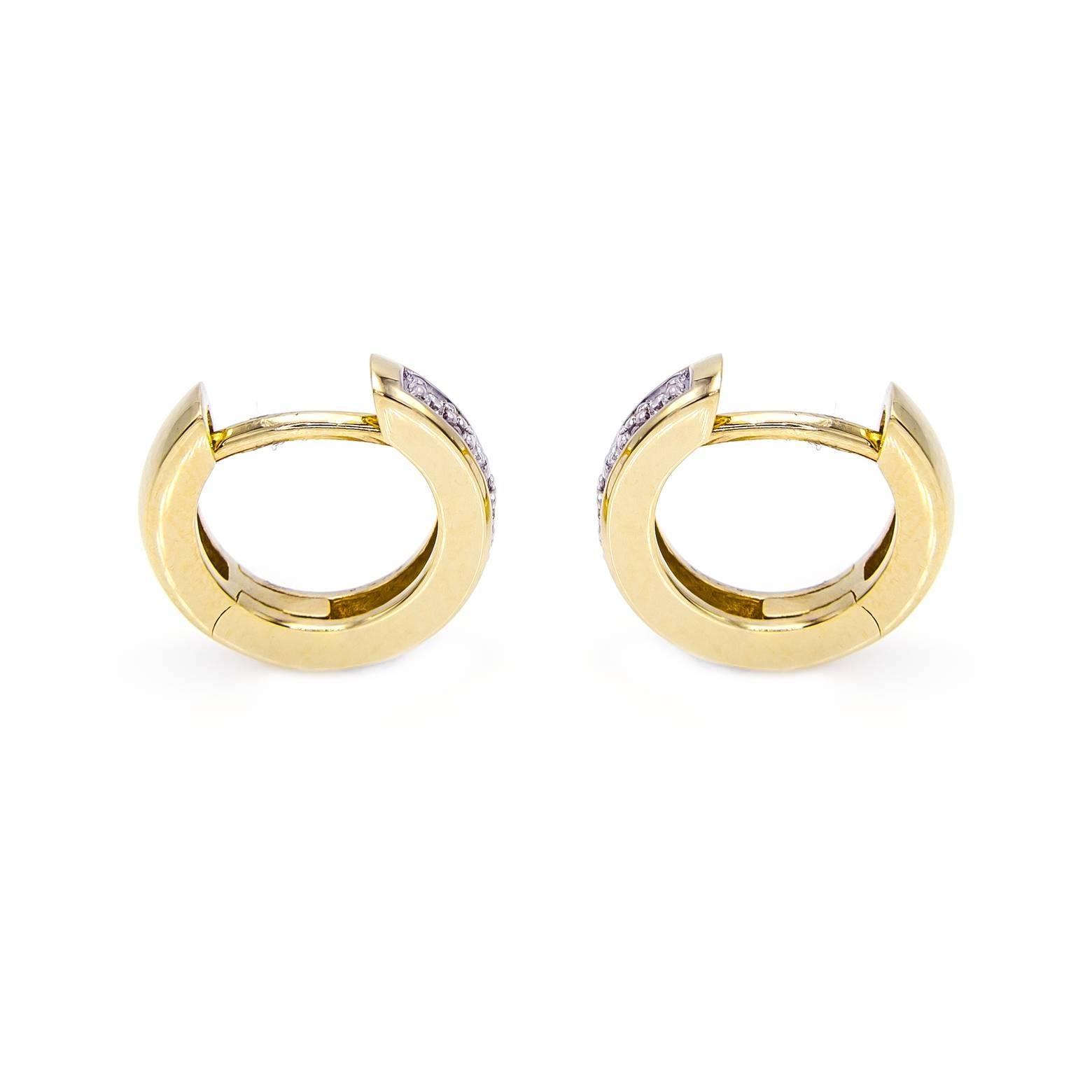 These lustrous yellow gold and diamond huggie hoops are dressed up with 5 diamonds on each earring. They fit comfortably, click into place and can easily be dressed up or down. Fashionable and glamorous! The total weight of the diamond are 0.06