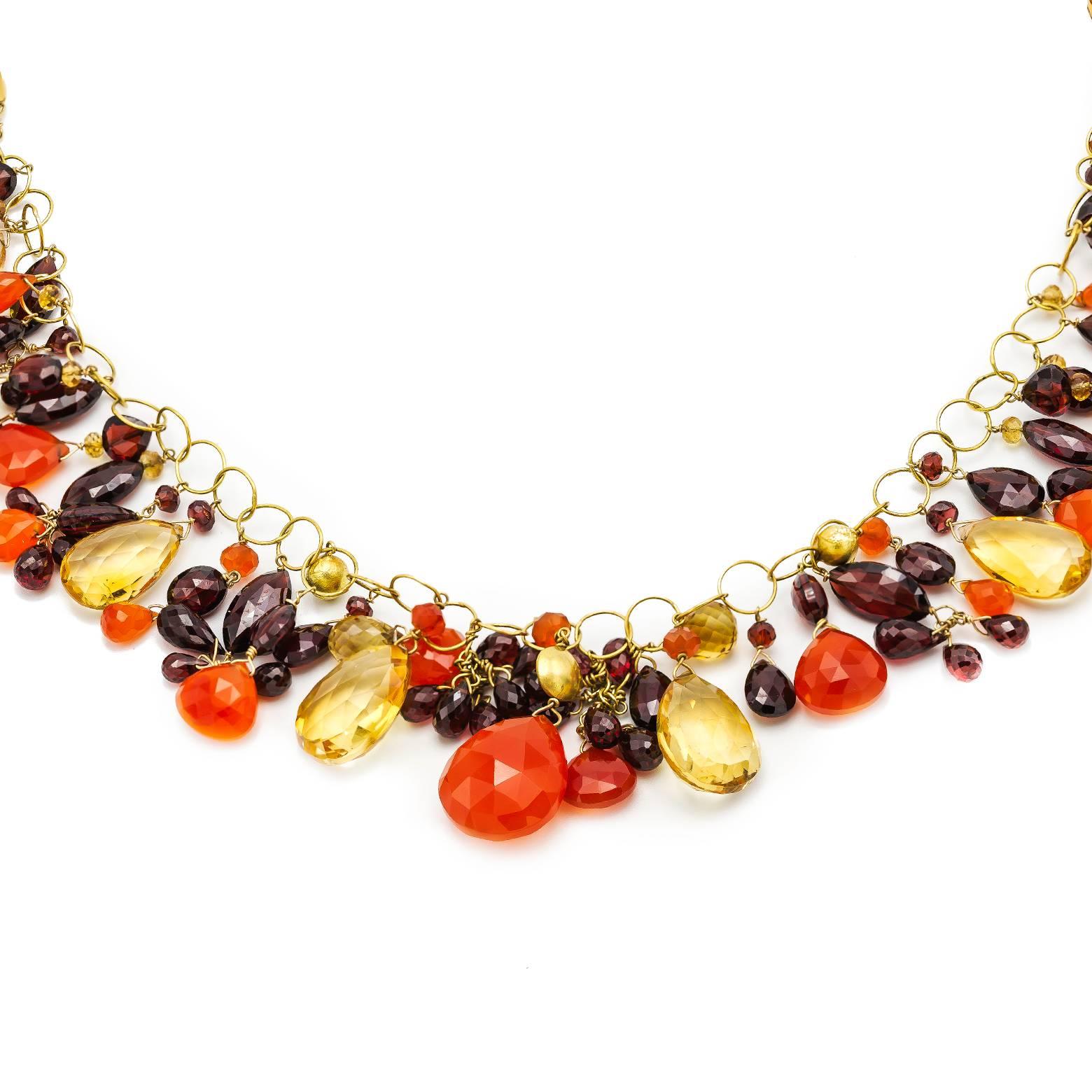 Twenty-eight and a half inches of gorgeous briolette beads in garnet, carnelian, and citrine. The substantial weight of this necklace feels great around your neck and chest while the faceted briolette beads sparkle and shine in beautiful earth