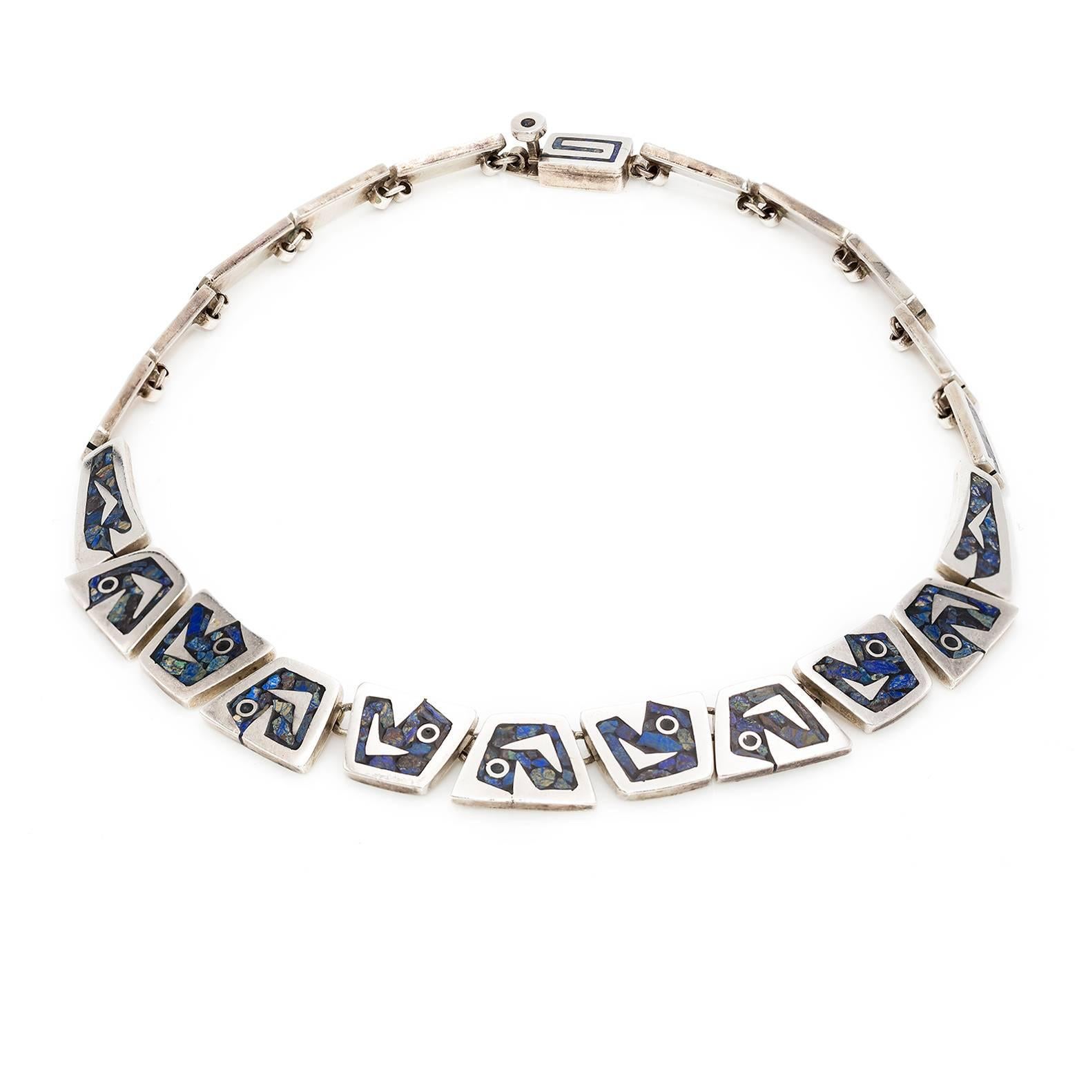 Handmade, detailed, carved, and inlaid link necklace with varying stones of lapis and chrysicola. This incredible necklace is made of Mexican sterling silver and stamped with the designer's emblem. Inquire about our matching bracelet