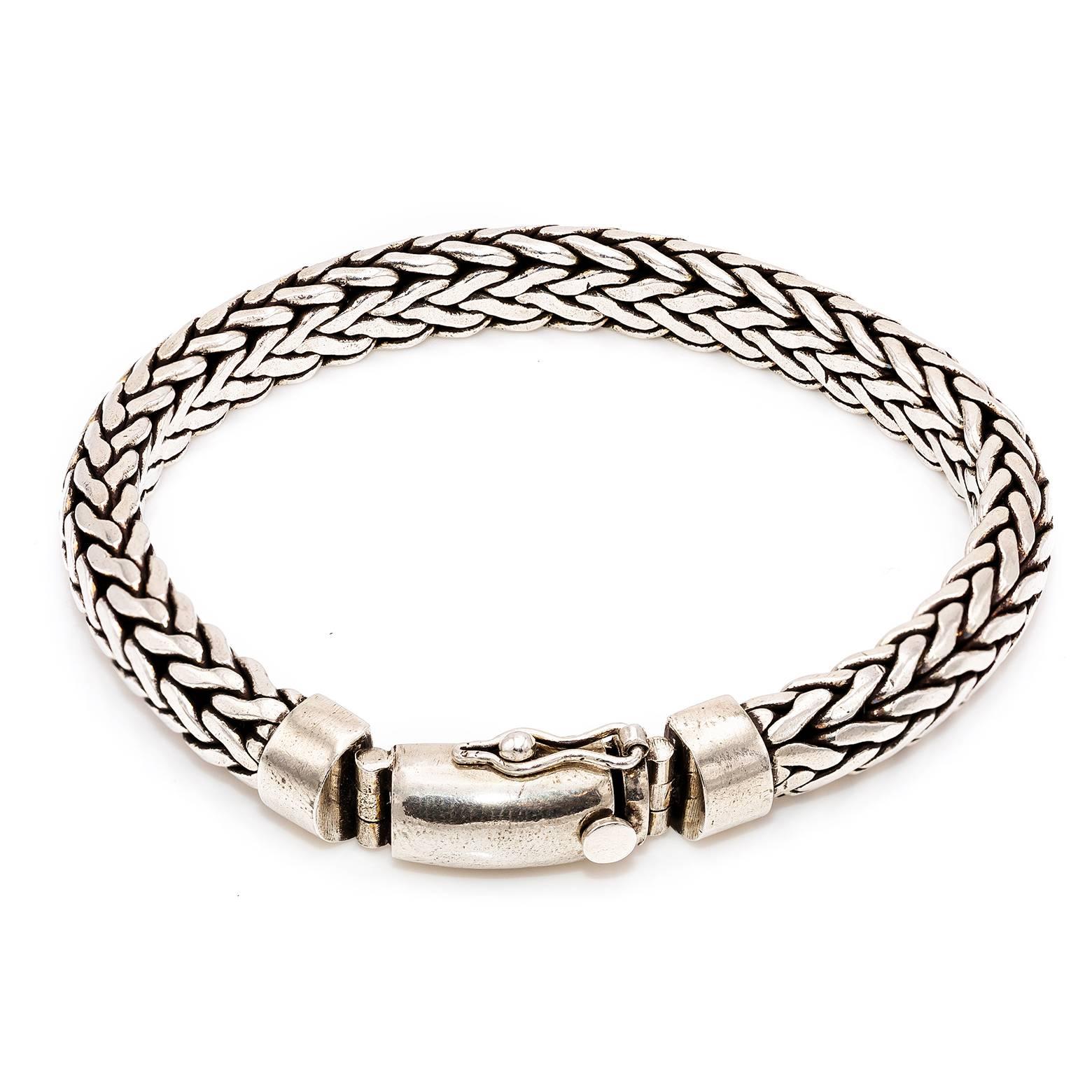 This woven sterling silver bracelet is comfortable and substantial. Oxidized in the creases, the contrasting black with bright sterling silver create a dynamic artistic look. 