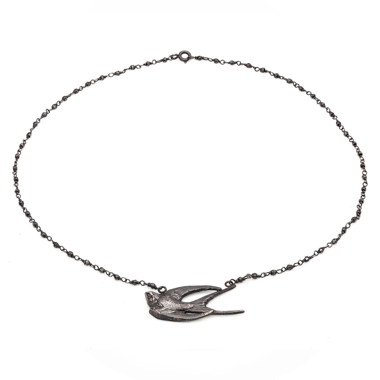 Soaring high this blackbird necklace is adorned with hematite beads along the oxidized sterling silver necklace. Artistic and magical and created here in the San Francisco Bay Area.