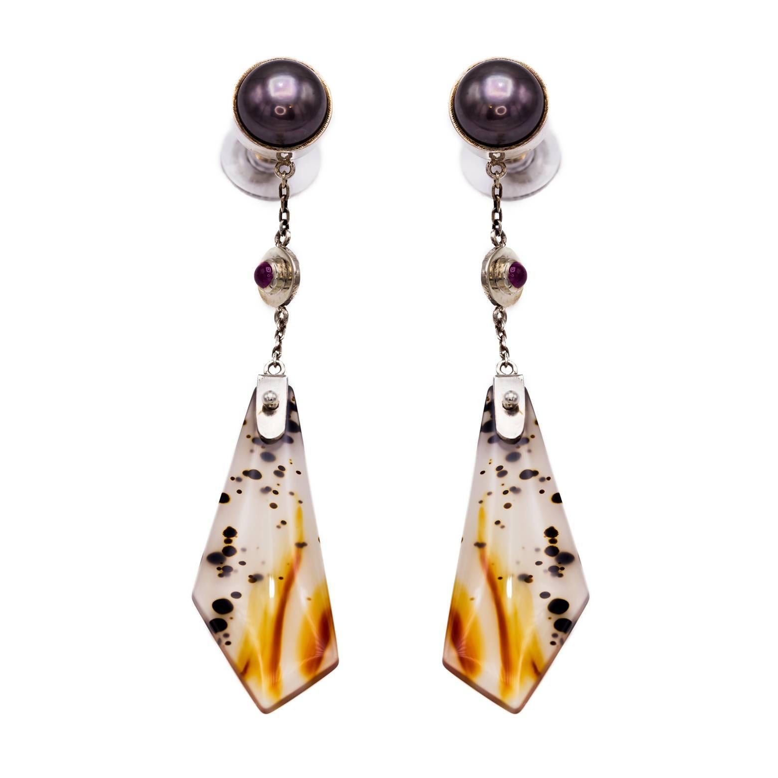 Elegant and fierce almost like an animal print of leopard and zebra together, these organic and angular earrings are a show stopper. Black Tahitian Pearl followed by bright rubies and then gorgeous Montana Agate, you can see the color all the way