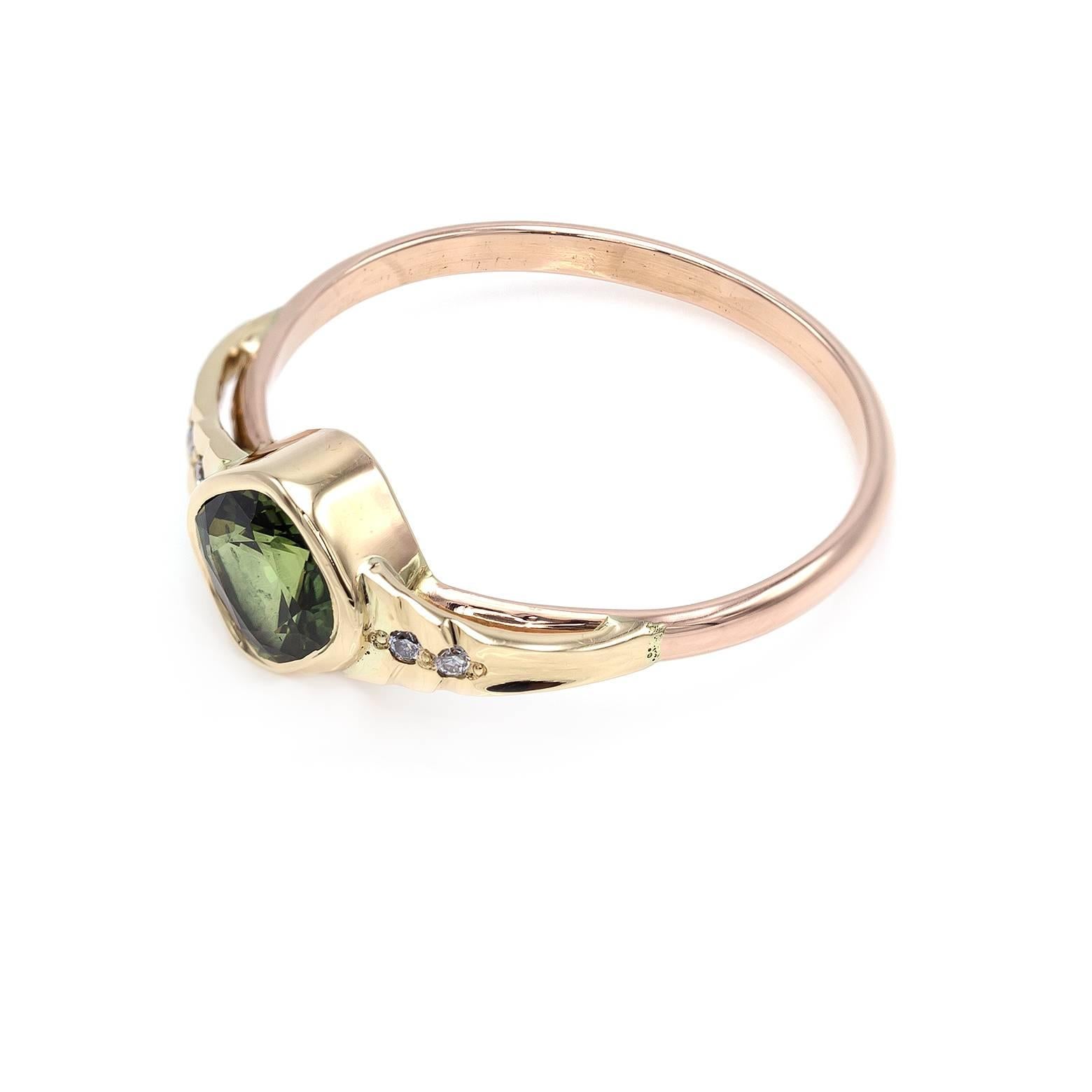 This elegant green sapphire ring shines and sparkles like a majestic deep forest and is adorned with four white accent diamonds. Set in rose gold with side step details this ring is sure to dazzle your wild imagination. 