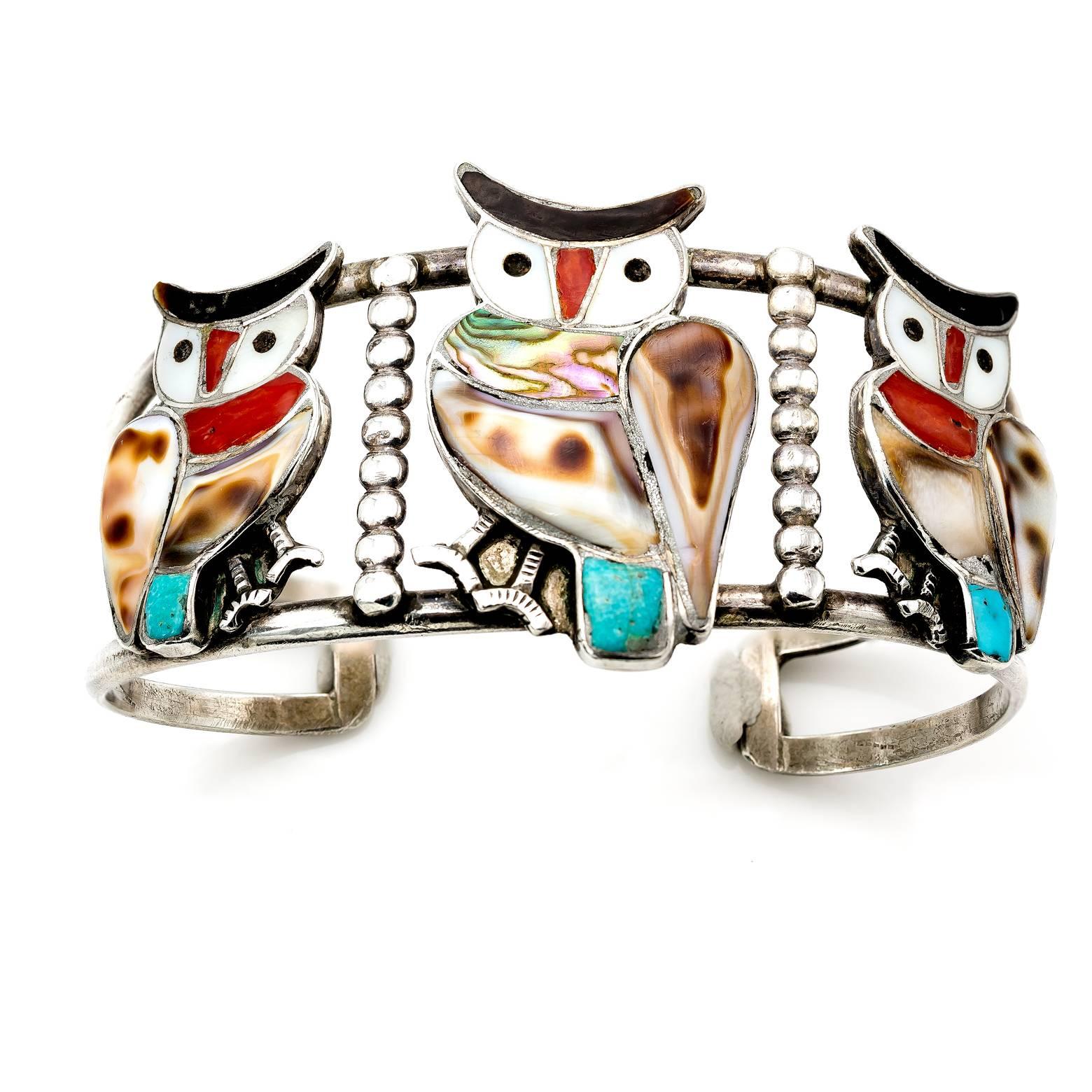 This vintage Zuni bracelet is stunning and spectacular with three owls perched next to teach other decked out in mother of pearl, abalone, shell and turquoise. A great collectors item, check out our 1st Dibs store for more Zuni items. 