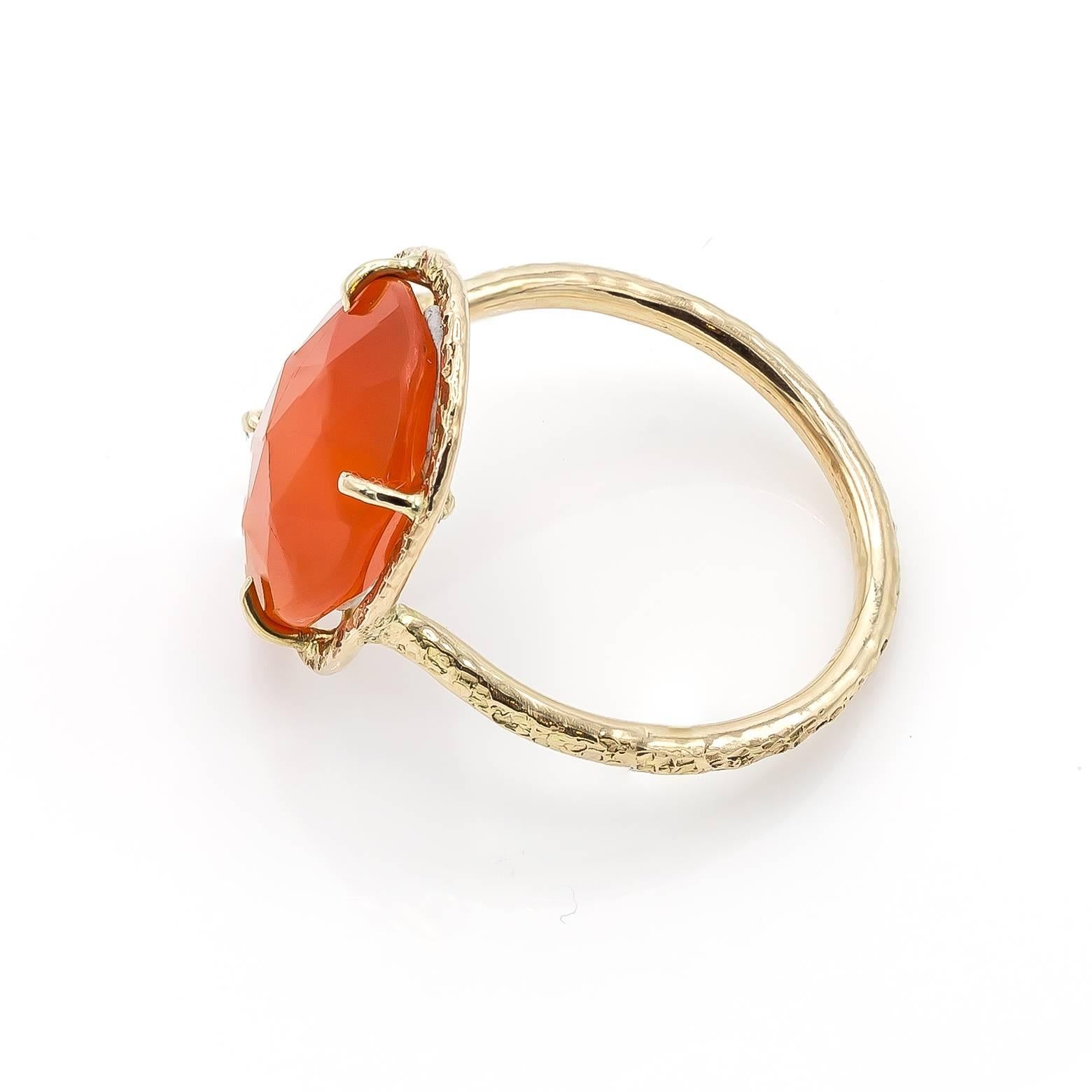 Starburst orange carnelian is surrounded and decorated in an artistic handmade yellow gold band with beautiful texture and style. Handmade in the San Francisco Bay Area this beauty delights, and adds fun and flare to any occasion. This ring is a