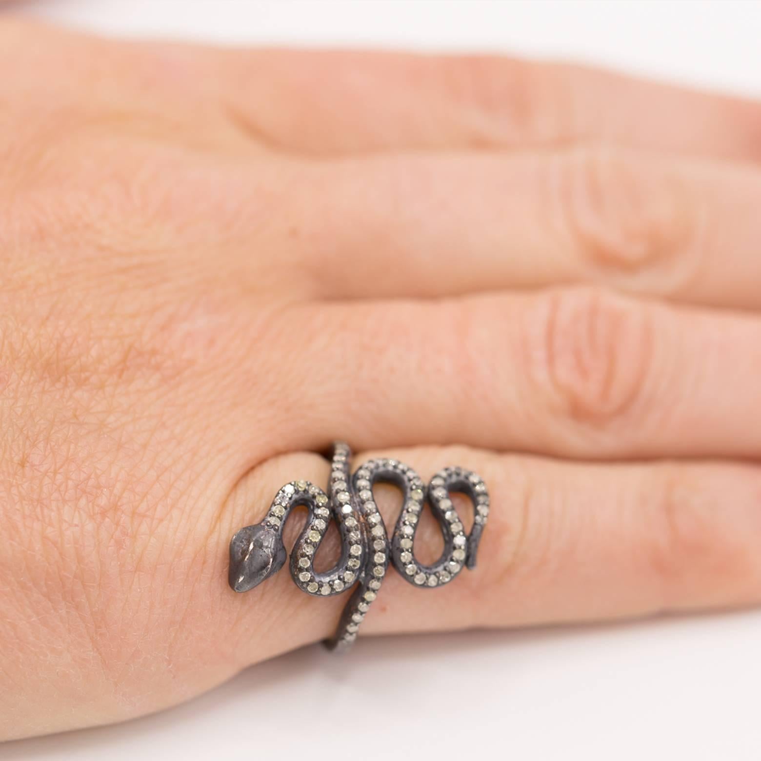 This diamond snake ring dazzles with movement as the snake is made up entirely of diamonds The oxidized outline further enhances the beautiful design of the ring. You will love wearing it and others will admire it! The ring is a size 4 and makes a