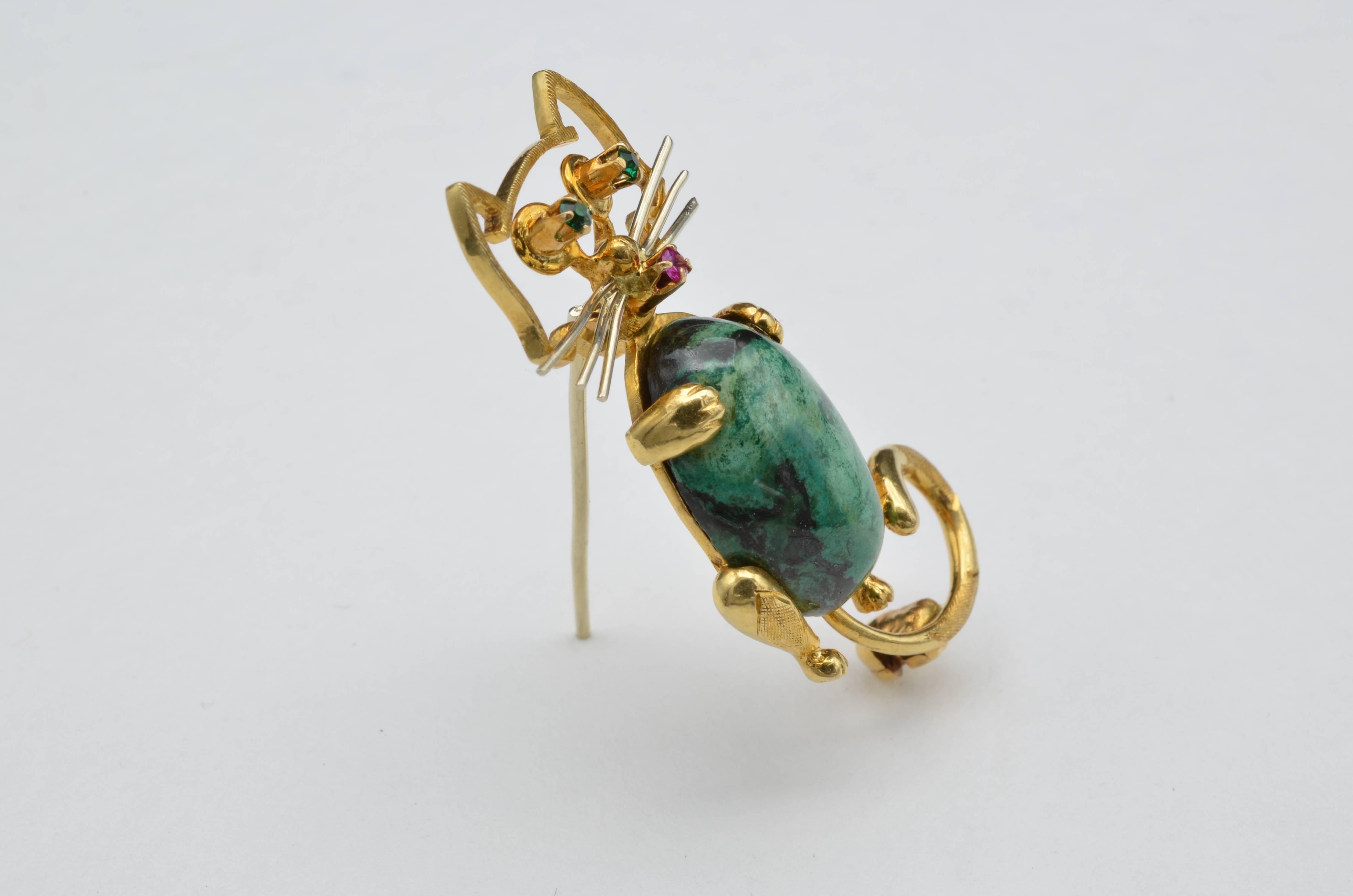 This is a very whimsical piece from the Pop Era of a Chrysocolla Cat with Emerald Eyes and a Ruby Nose.  Really fun character with this big cabochon belly. Amusing and 18K Yellow Gold stamped and from Italy. 
