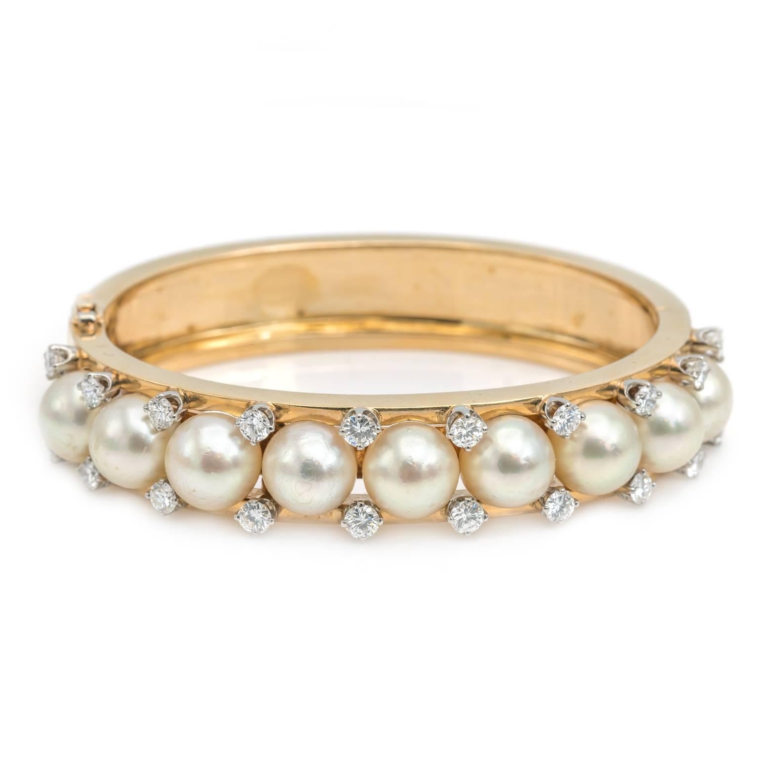 This stunning bracelet is beautiful showcasing a multitude of salt water pearls and twenty diamonds. The diamonds are VS/VS2 G/H set in 14k yellow gold and is very substantial. 

