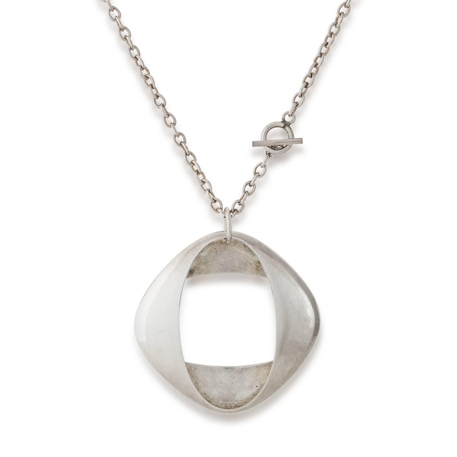 This Henning Koppel Designed Pendant necklace for the Georg Jensen Studio in Denmark is simple in design and a timeless piece of jewelry to wear for years to come.
