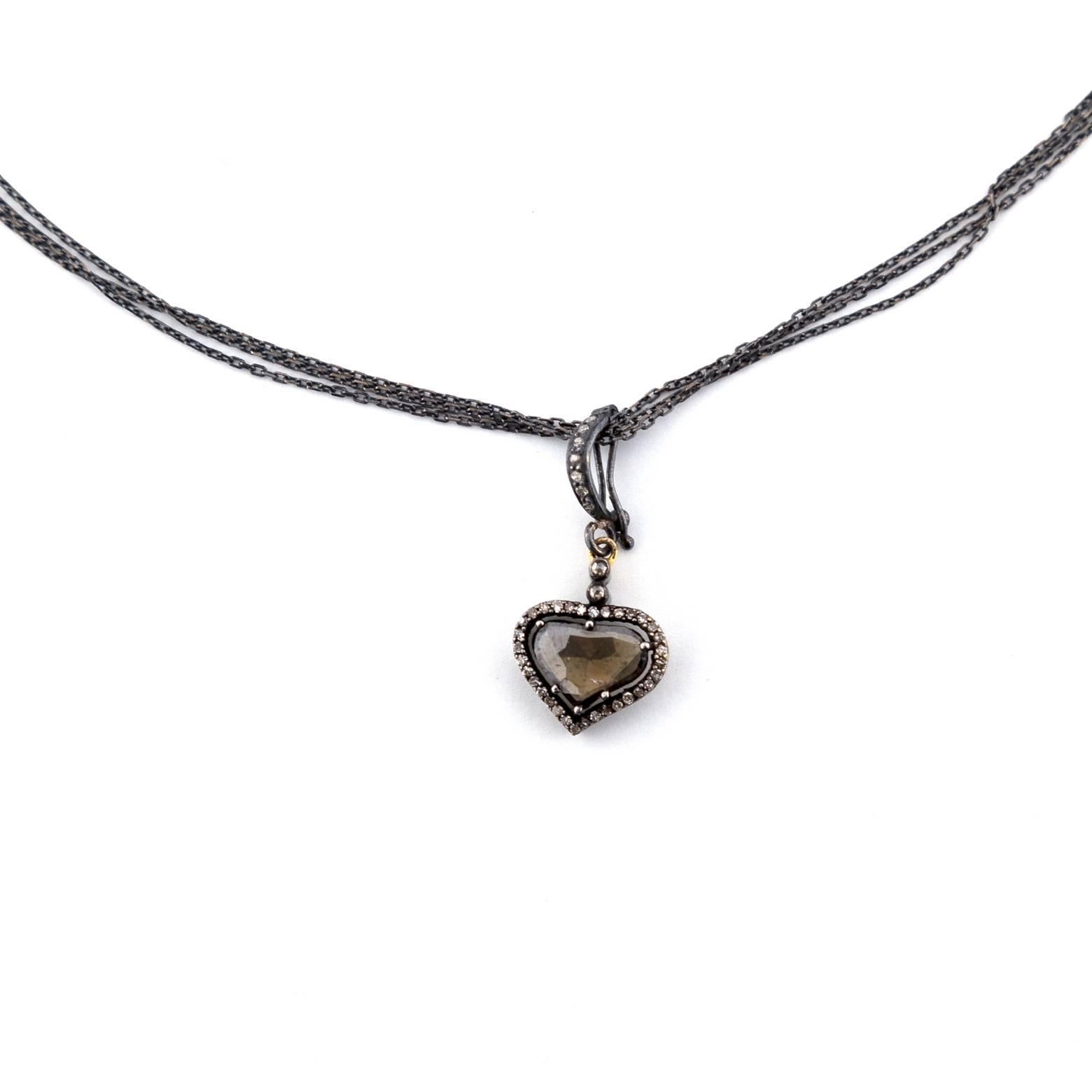 Oxidized Sterling Silver necklace with a heart-shaped ~2.75ct Diamond slice surrounded by a diamond bale. This piece is beautiful and you can take the pendant off to play with different styles. 