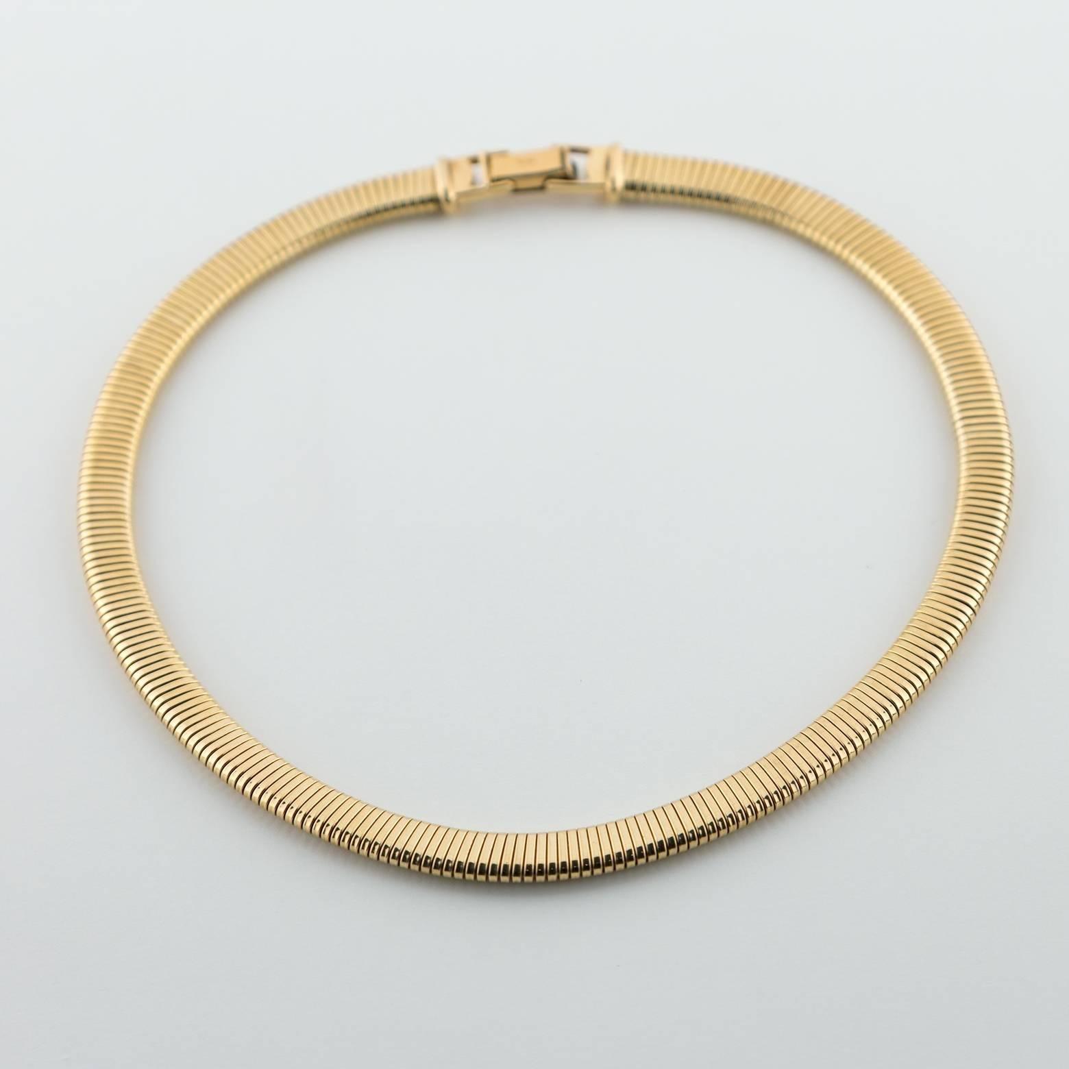 This beautiful 14K gold choker is a stunner! Elegant, bright, solid and stable this gold necklace is a perfect for any occasion and has a little stretch to it. You could easily add a pendant to it for a totally different look.