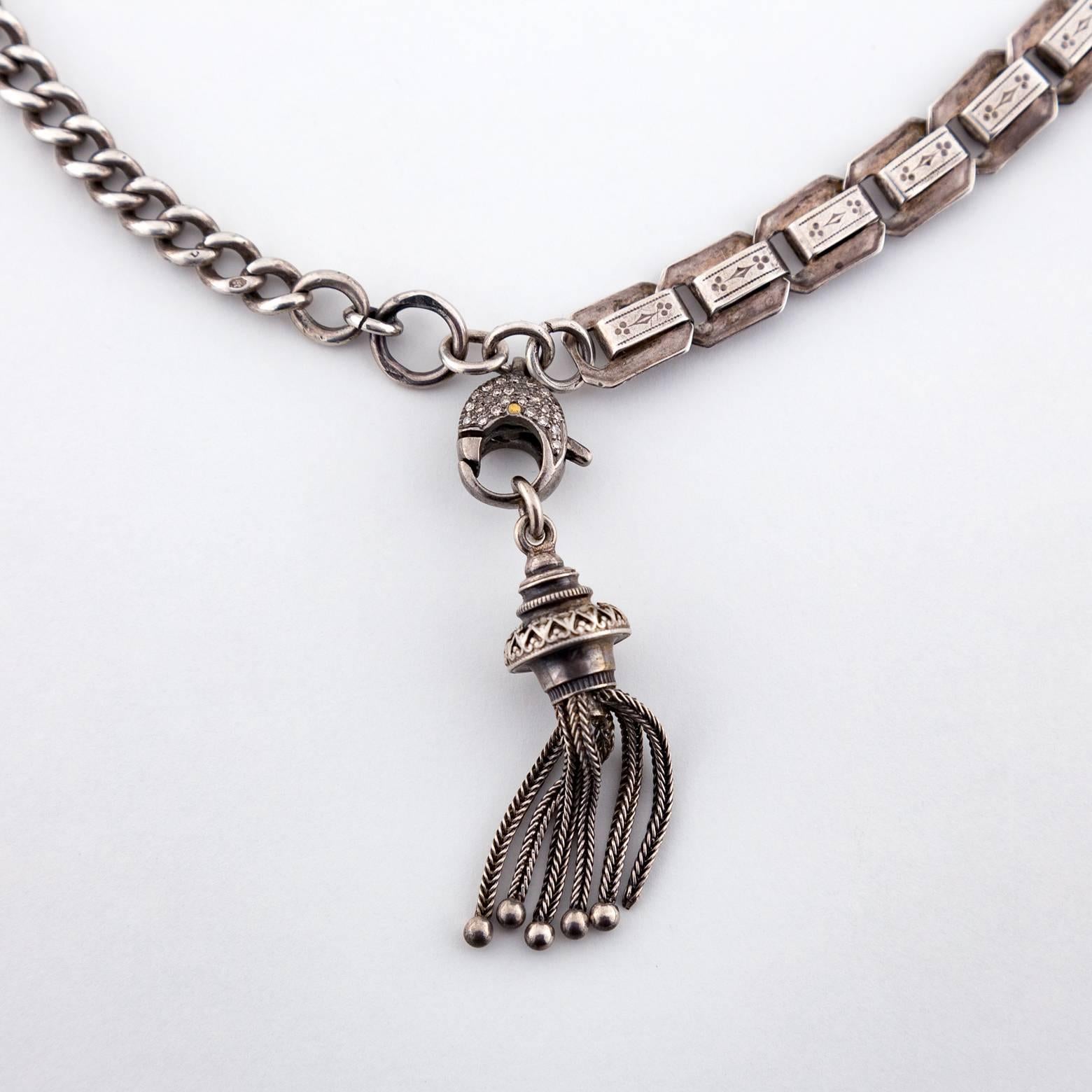 This beautiful chain and chain link necklace comes alive with a diamond tassel that compliments the different textures of the chains. A perfect balance of the masculine and feminine. It can be easily dressed up or dressed down. 