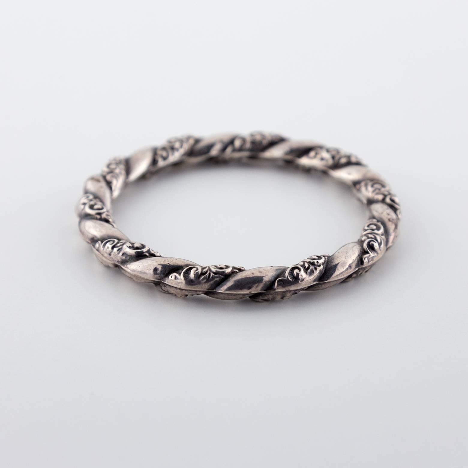 This lightweight sterling silver bangle is so delicate and elegant with such beautiful detail in the swirling patterns it's clearly Victorian. Easily stack-able or worn alone this piece is so very versatile! Stunning, unique, and intricate!