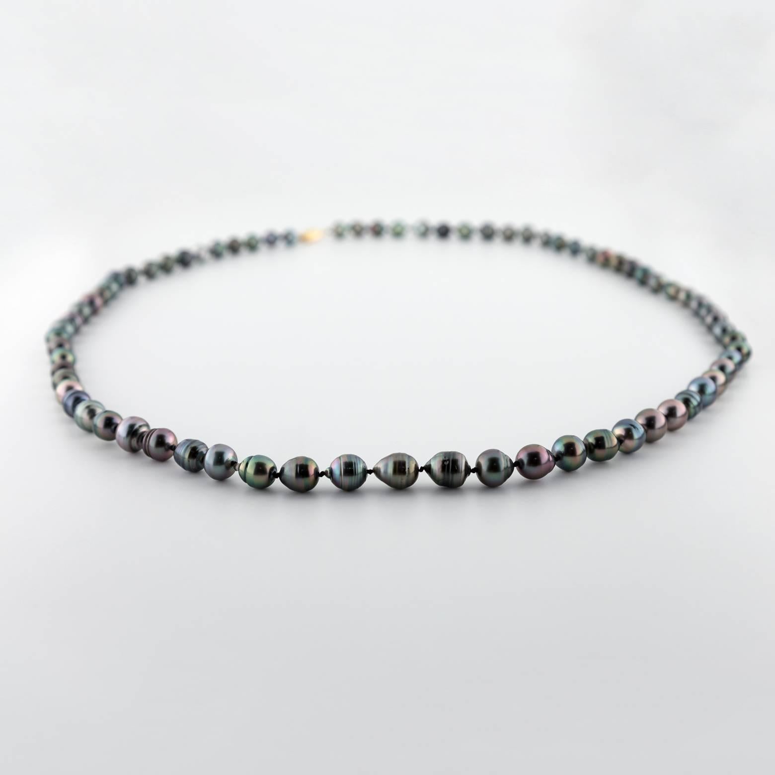 This a 33 inch long South Sea Black Tahitian Pearl necklace that you could easily wrap around twice for a stunning and alternating look. These pearls are gorgeous! Each one is unique and slightly reflects whatever color you are wearing. A perfect