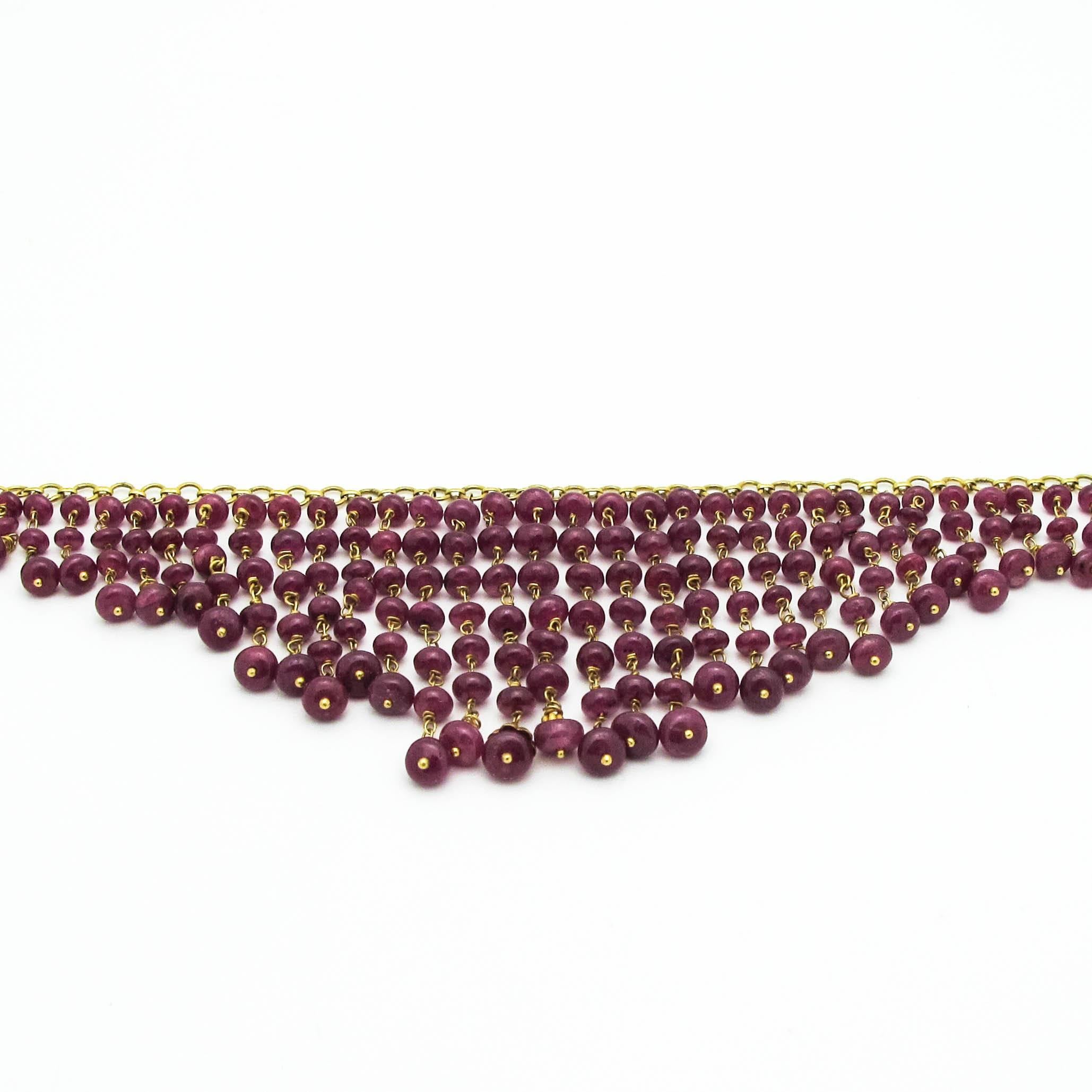 This is a beautiful ruby necklace. It's delicate, festive and feels great! The rubies are a rich warm medium dark pink and the gold is absolutely stunning!
