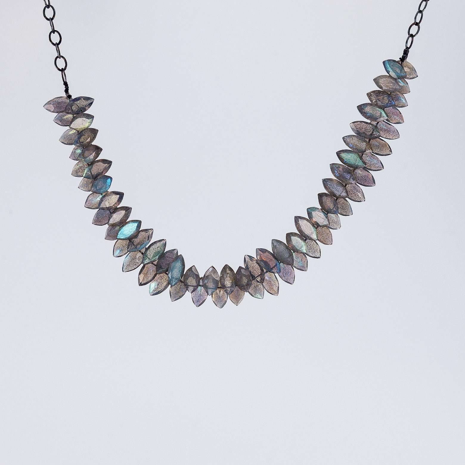 This unique oxidized sterling silver necklace with marquise labradorite beads exudes a glow. The length is adjustable with the wider chain and it looks great as a choker and great as a longer necklace. It is iridescent and fabulous! 